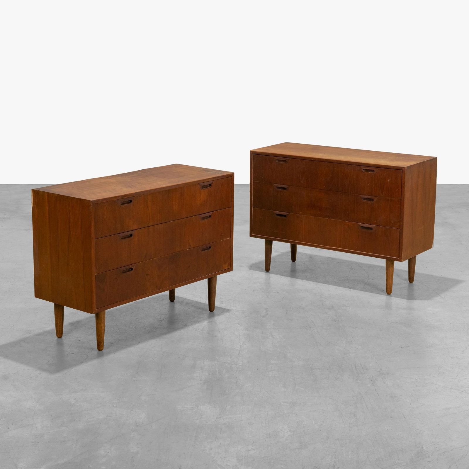 Niels Eilersen - Teak Chests: A pair of teak chests by Niels Eilersen 29 x 39.5 x 16. Measurements are in inches. (Height x Width x Depth)