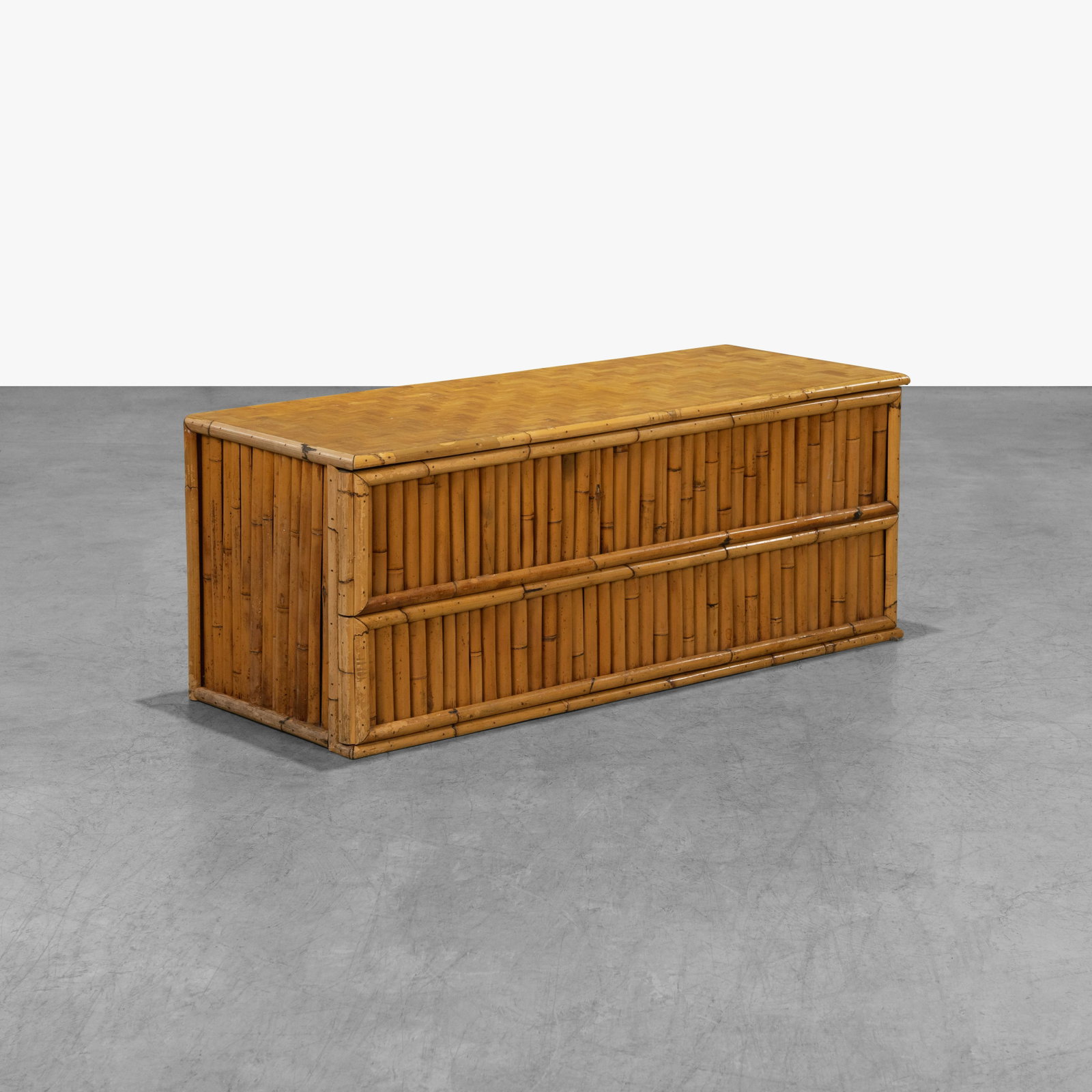 Rattan Low Chest: A vintage rattan low chest with woven cane top. 21 x 54 x 20.5. All measurements are in inches.