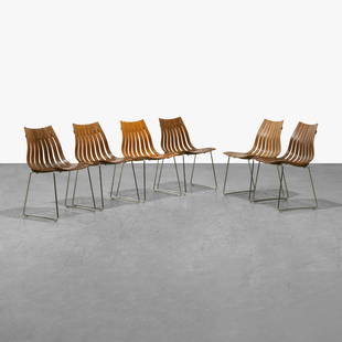 Hans Brattrud - Scandia Dining Chairs: A set of six 'Scandia' dining chairs by Hans Brattrud. Five in rosewood and one in teak. 31 x 18 x 21. All measurements are in inches.