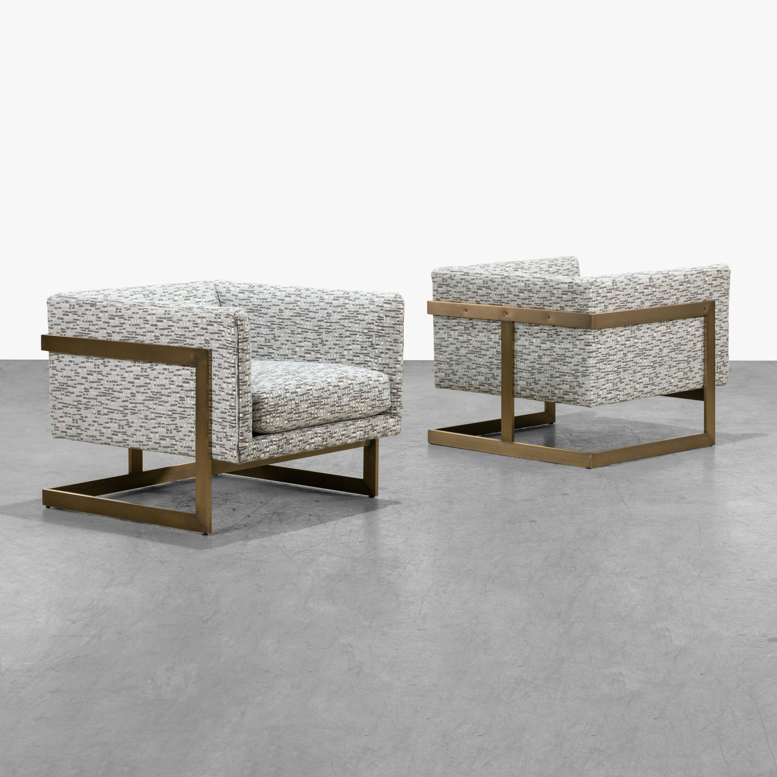 Milo Baughman - Club Chairs: A pair of cantilevered club chairs with brushed brass finished bases by Milo Baughman for Thayer Coggin. 25.5 x 30.5 x 31.5. All measurements are in inches.