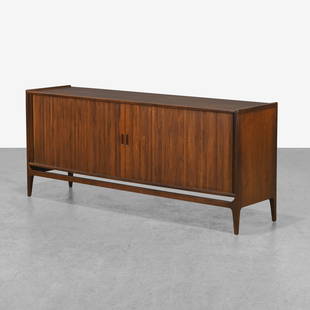 Richard Thompson - Credenza: A walnut credenza by Richard Thompson for Glenn of California. With tambour doors and birch interior. 30.5 x 71 x 18 . Measurements are in inches. (Height x Width x Depth)