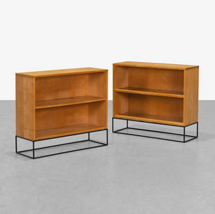 Paul McCobb - Bookcases: A pair of matching Planner Group bookcases by Paul McCobb on iron bases. 31 x 16.5 x 25. Measurements are in inches. (Height x Width x Depth)