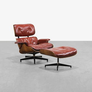 Charles & Ray Eames - Lounge Chair & Ottoman: A vintage 670 lounge chair and matching 671 ottoman by Charles and Ray Eames in rosewood and red leather. Circa 1956-1964. Chair - 32.5 x 33.5 x 32 / Ottoman - 16.5 x 25.5 x 20.5 . Measurements are in