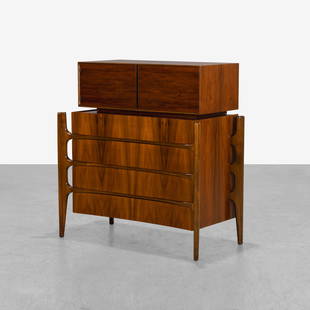 William Hinn - High Chest: A sculpted walnut high chest with floating leg construction and separate top cabinet that can be removed. Stamped on back. 47 x 44.5 x 24. Measurements are in inches. (Height x Width x Depth)