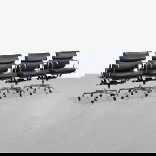 Charles & Ray Eames - Softpad Chairs: A set of four leather 'Softpad' chairs by Charles and Ray Eames for Herman Miller. 2011 production. 32 x 23 x 26. Measurements are in inches. (Height x Width x Depth)