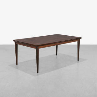 Niels Moller - Rosewood Extension Table: A rosewood dining table with two pull out leaves by Niels Moller. Closed - 29 x 71 x 41 / Leaves - 23 each . Measurements are in inches. (Height x Width x Depth)