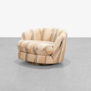 Milo Baughman - Oversized Swivel Chair: An oversized swivel chair on an upholstered pedestal base, by Milo Baughman. 28 x 45.5 x 36. Measurements are in inches. (Height x Width x Depth)