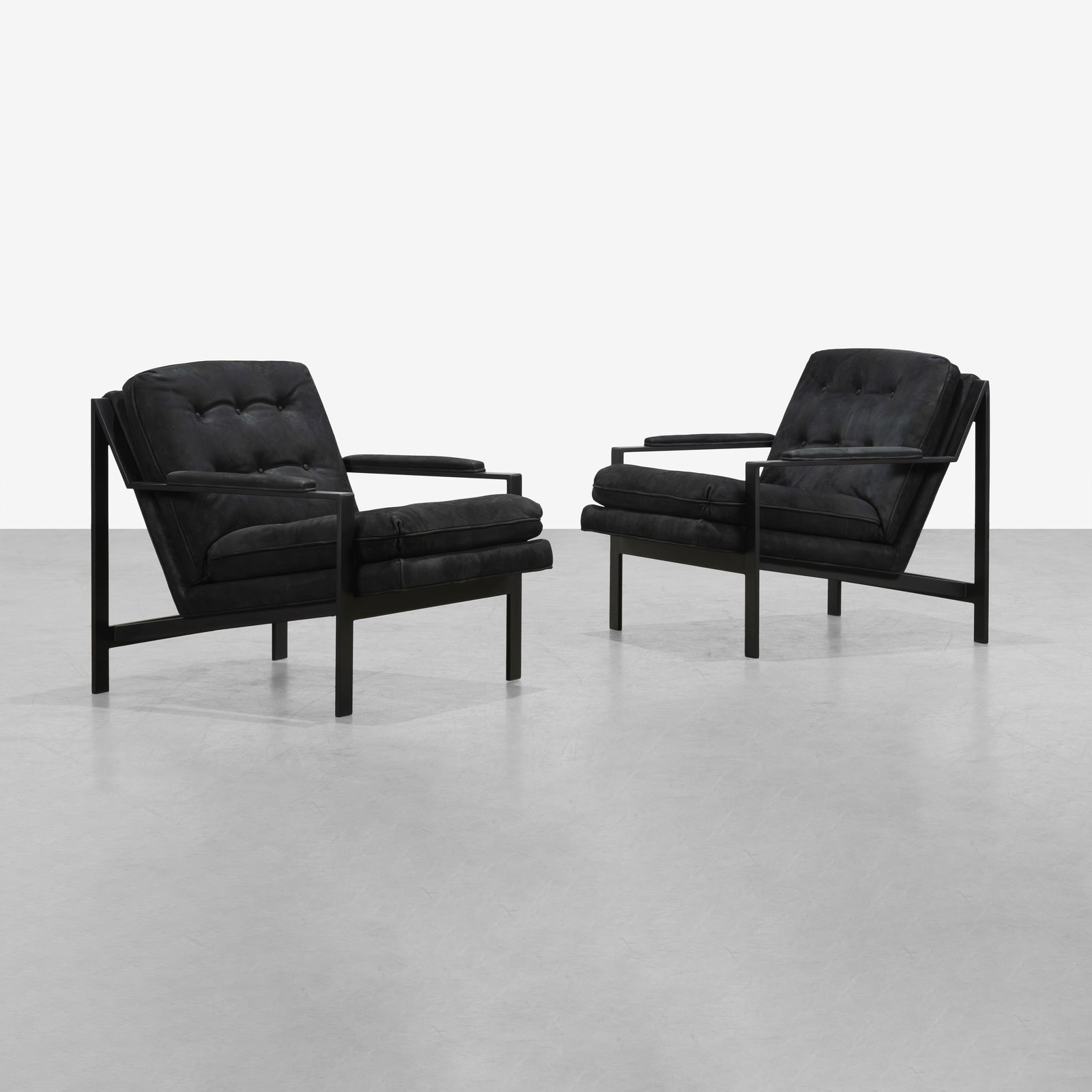 Cy Mann - Lounge Chairs: A pair of lounge chairs in leather by Cy Mann. 28 x 29.5 x 33. Measurements are in inches. (Height x Width x Depth)