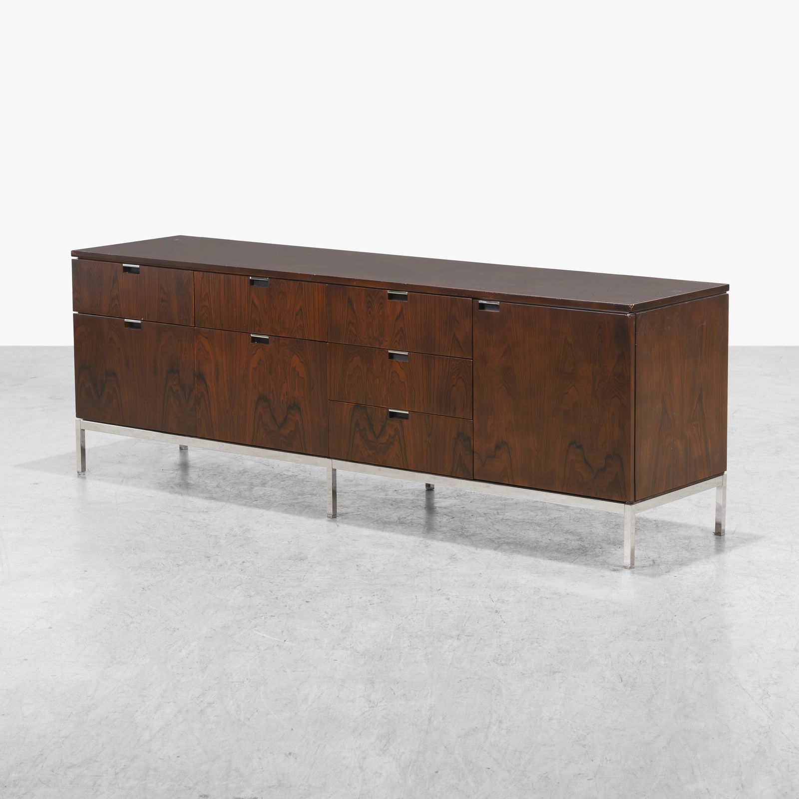 Florence Knoll - Rosewood Credenza: A vintage rosewood credenza by Florence Knoll. 26 x 74 x 18.5. Measurements are in inches. (Height x Width x Depth)