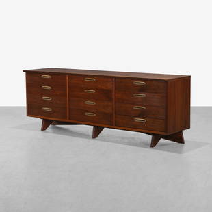 George Nakashima - Origins Dresser: A twelve drawer walnut dresser with sculpted walnut trestle legs. 32.5 x 90 x 22.5. Measurements are in inches. (Height x Width x Depth)