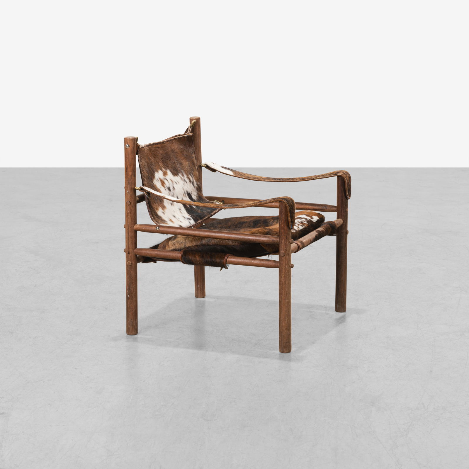 Arne Norell - Safari Chair: A vintage 'Safari' chair in pony hide , designed by Arne Norell. 28 x 26 x 26. Measurements are in inches. (Height x Width x Depth)