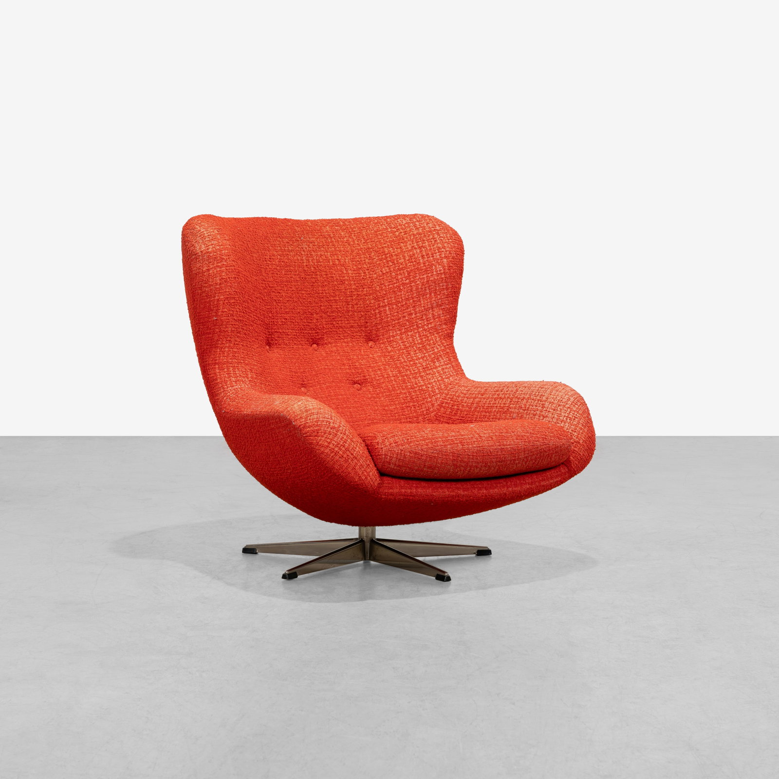 Swiveling Club Chair: A vintage swiveling club chair in the manner of Illum Wikkelso. 35 x 37 x 36. All measurements are in inches. (Height x Width x Depth).