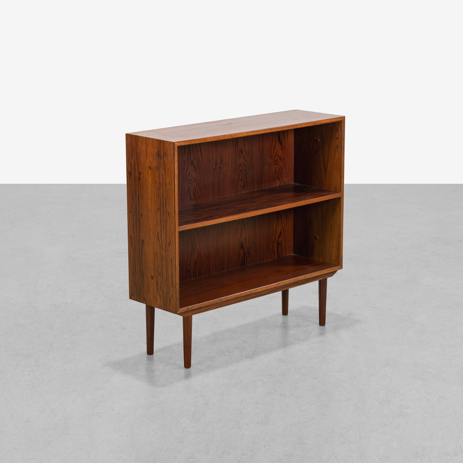 Danish Rosewood Bookcase: A vintage rosewood bookcase by Horsens Mobelfrabik, Denmark. 32.5 x 33.75 x 10.25. All measurements are in inches. (Height x Width x Depth).