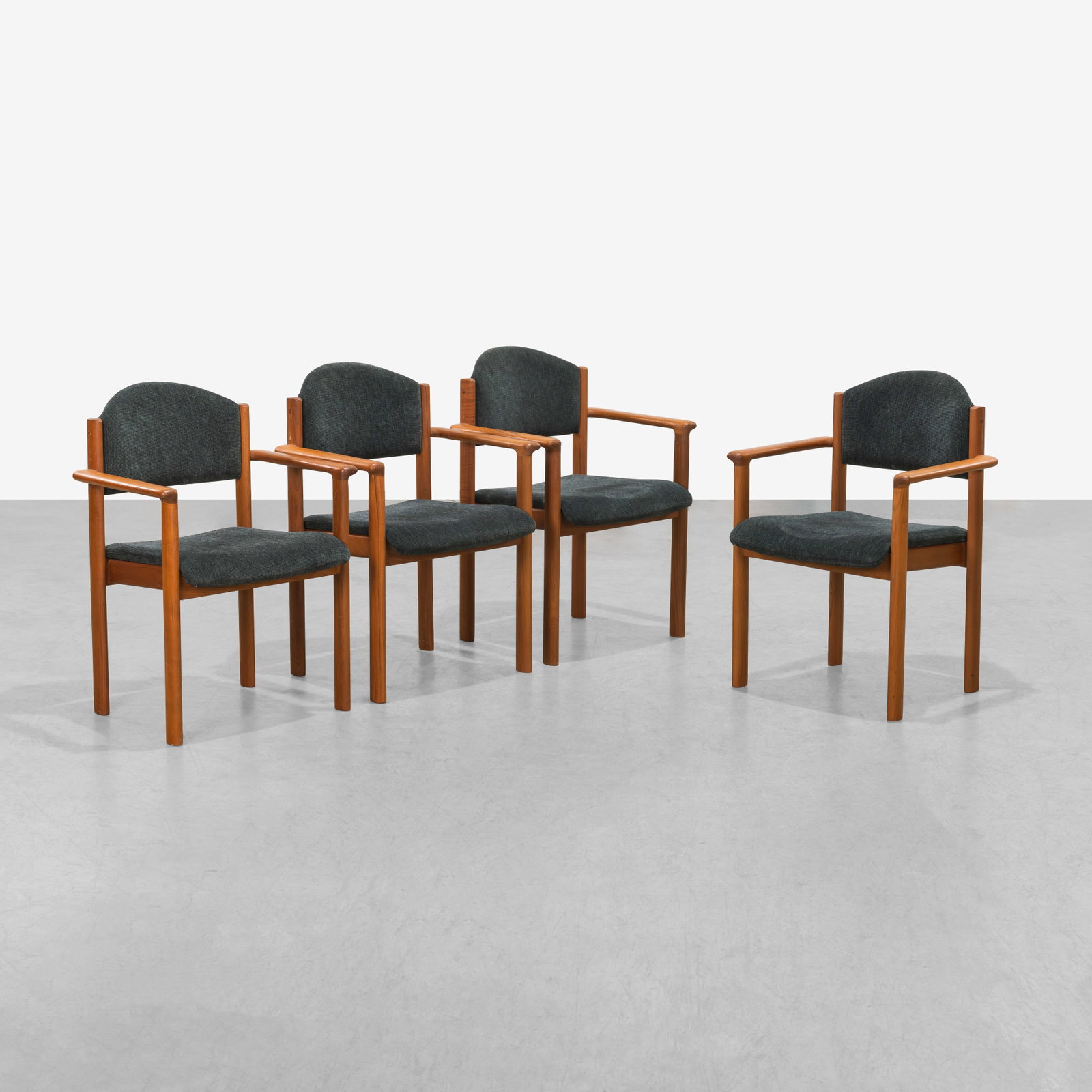 Teak Armchairs: A set of four Danish style teak armchairs. 32.5 x 23.5 x 21. All measurements are in inches. (Height x Width x Depth).