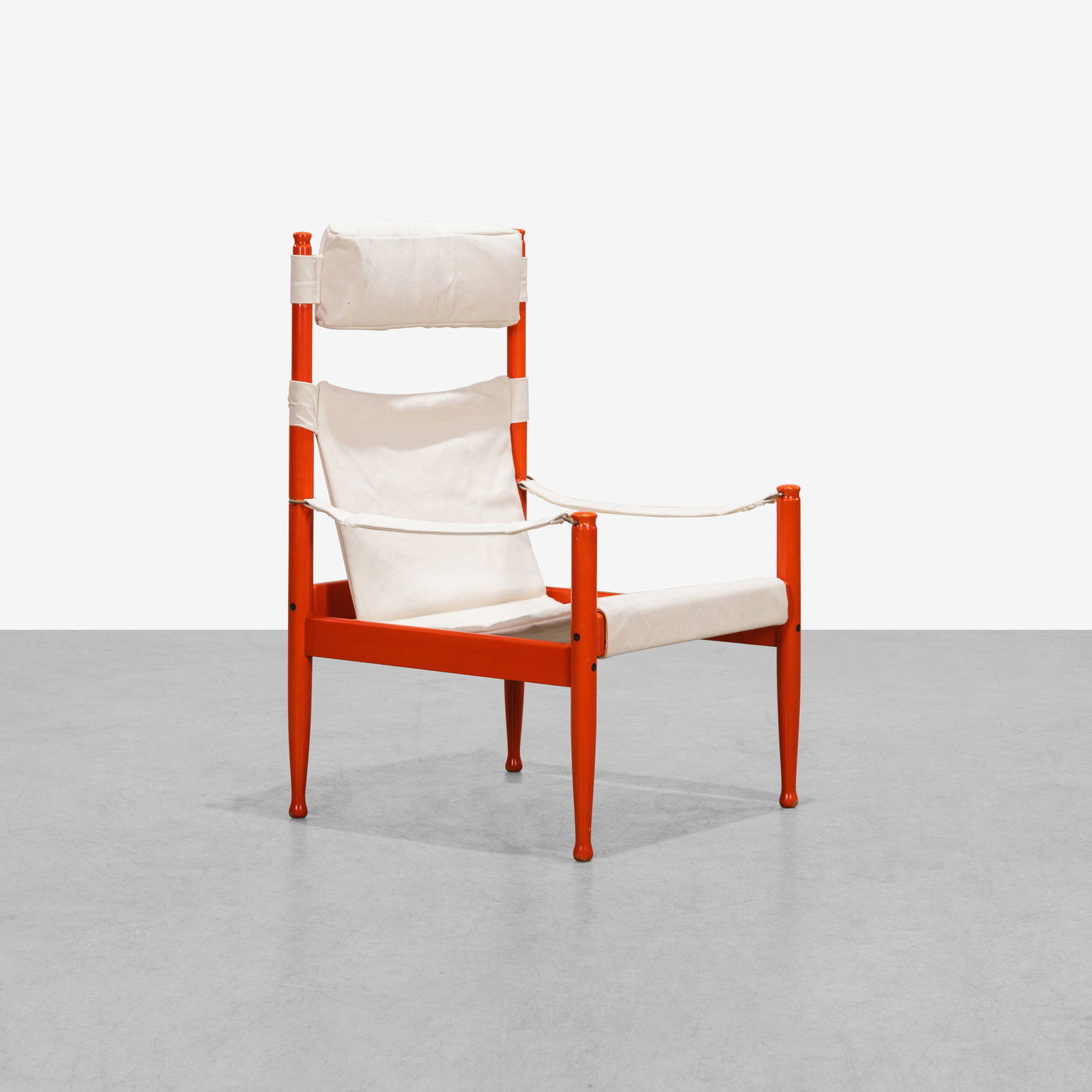 Erik Worts - Safari Chair: An orange lacquered, high back 'Safari' chair by Erik Worts for Niels Eilersen, Denmark.