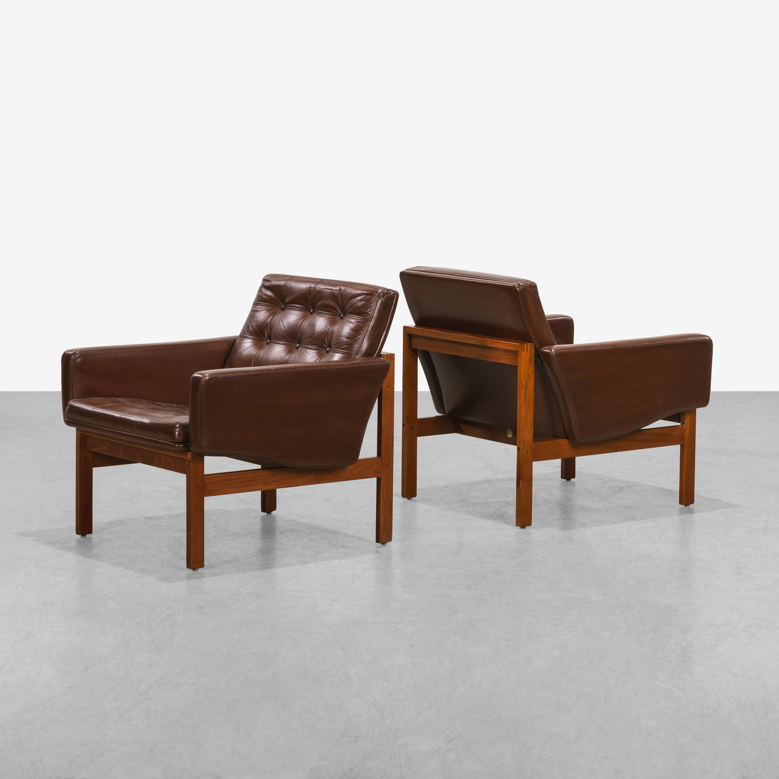 Ole Gjerlov-Knudsen - Moduline Chairs: A pair of leather and teak 'Moduline' chairs by Ole Gjerlov-Knudsen and Torben Lind for France and Son.