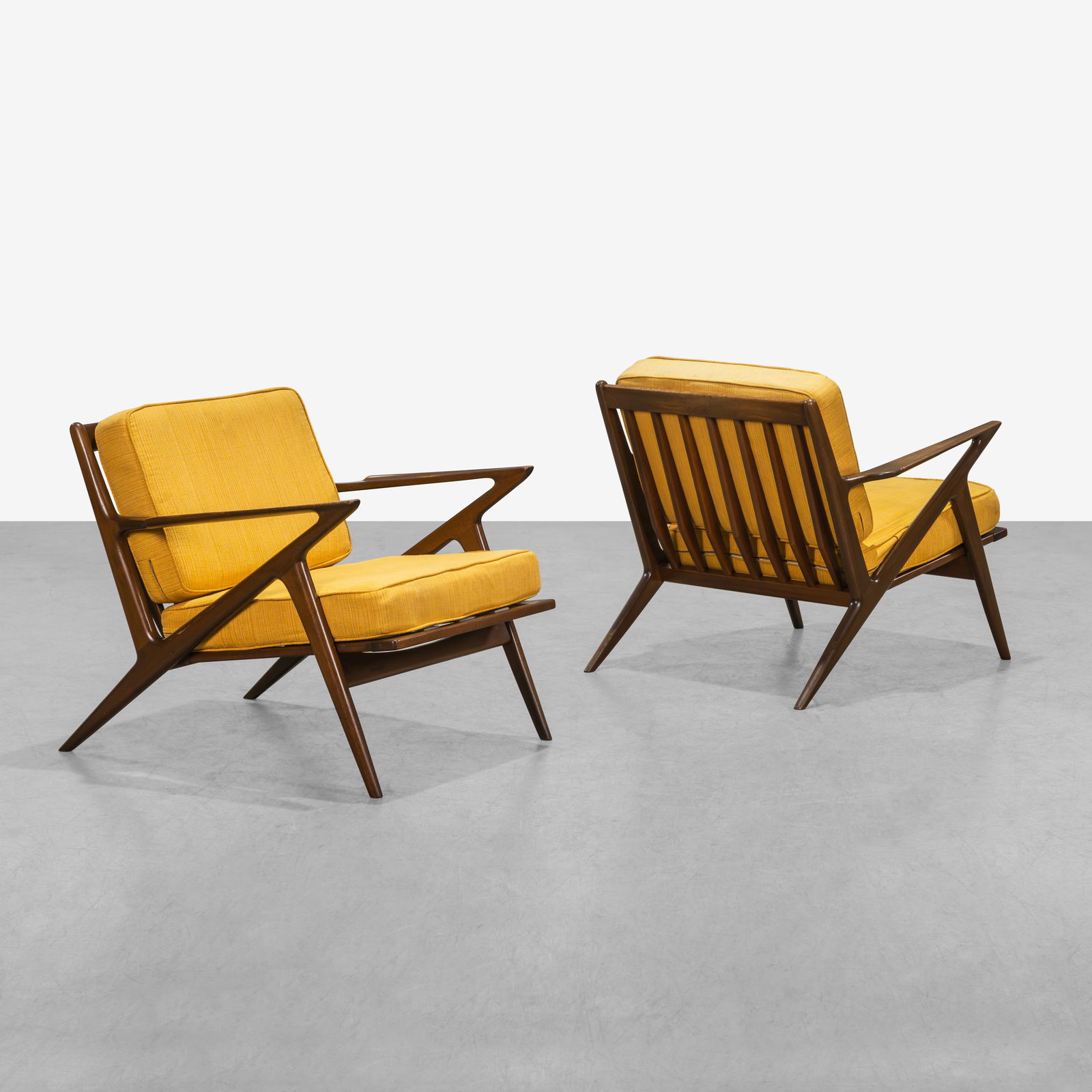 Poul Jensen - Z Lounge Chairs: A pair of 'Z' lounge chairs in walnut by Poul Jensen for Selig.