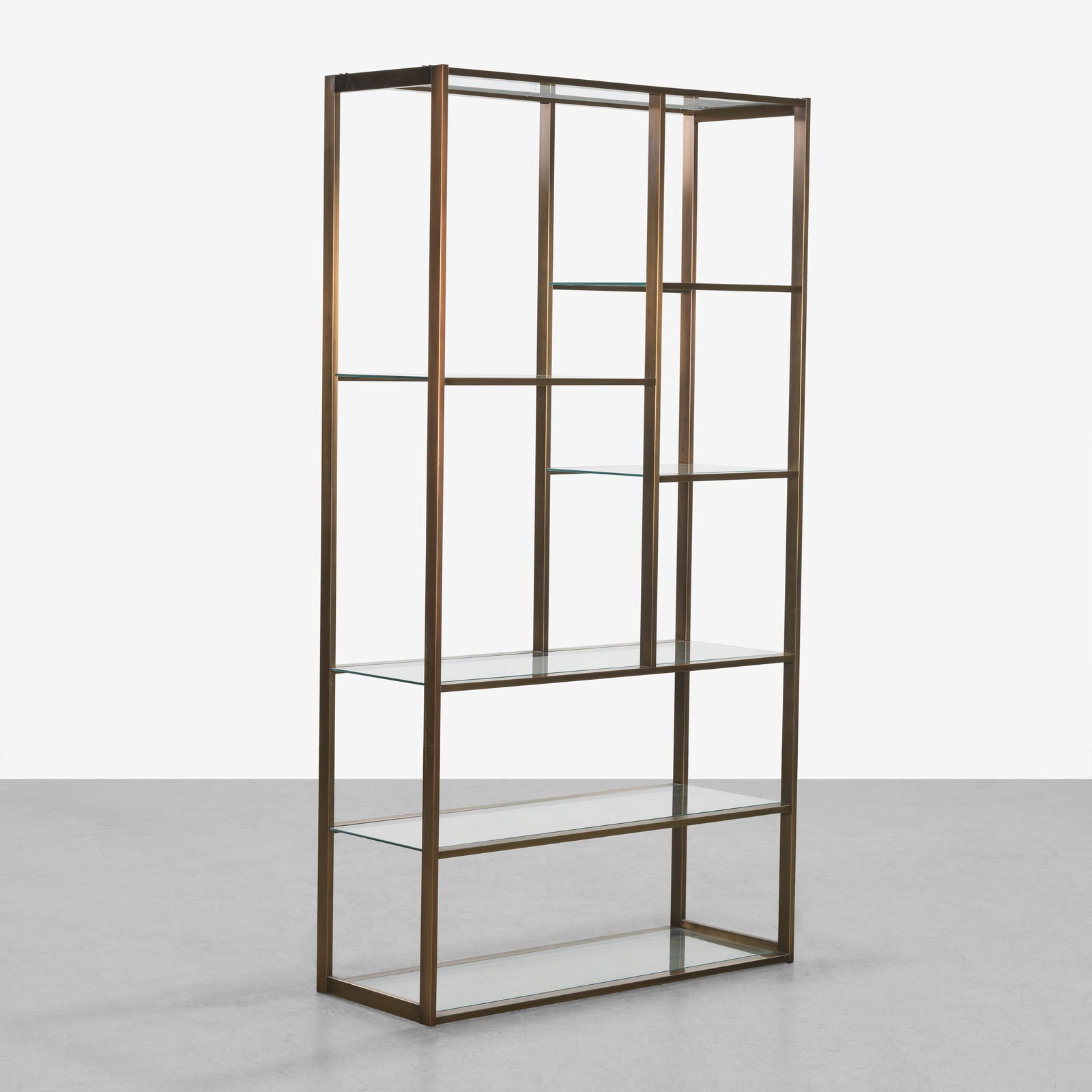 Milo Baughman (Attr.) - Etagere: A brushed bronze finished etagere with glass shelves attribute to Milo Baughman.