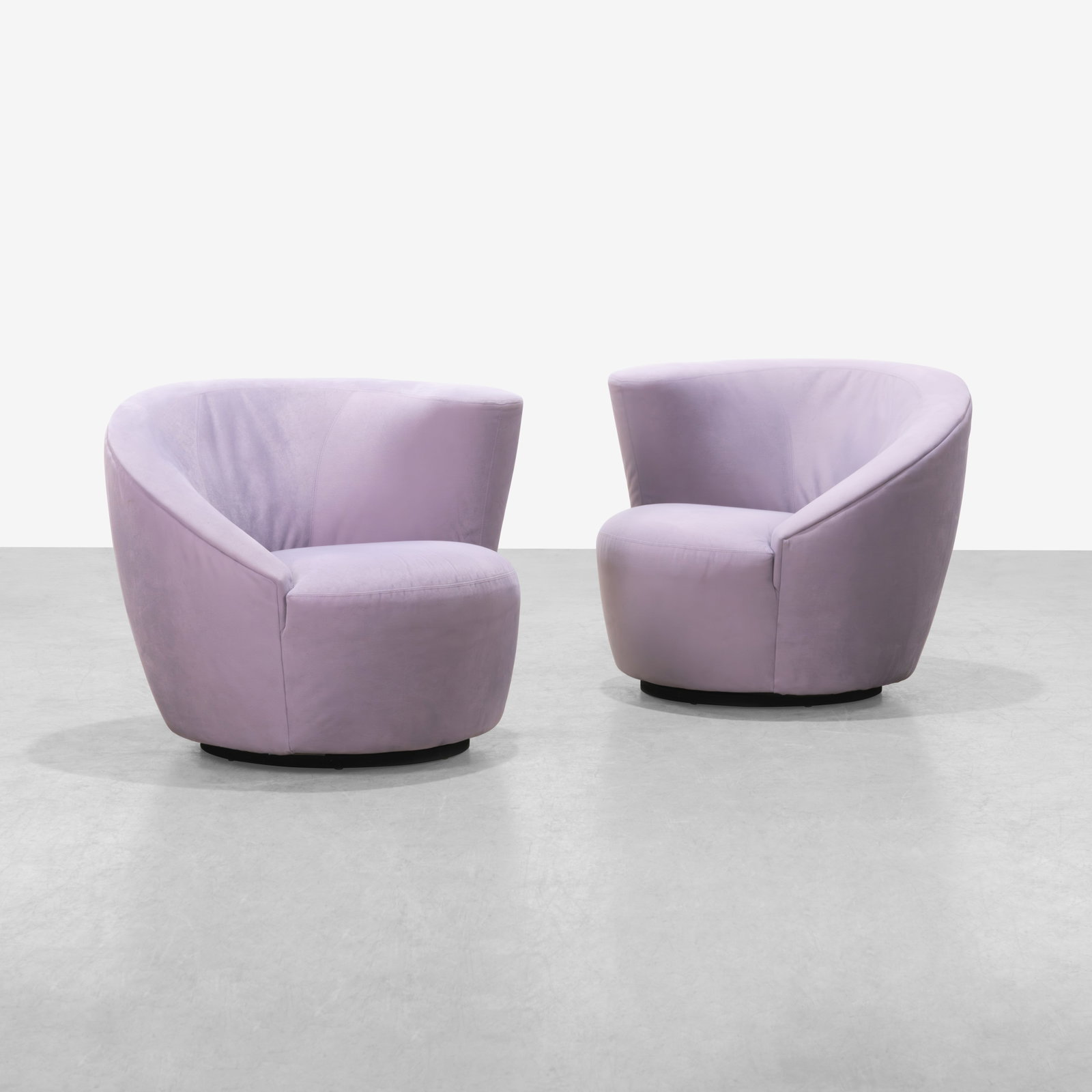 Vladimir Kagan - Nautilus Chairs: A pair of swiveling 'Nautilus' club chairs by Vladimir Kagan for Weiman in suede. Label on bottom. All measurements are in inches. Height x Width x Depth