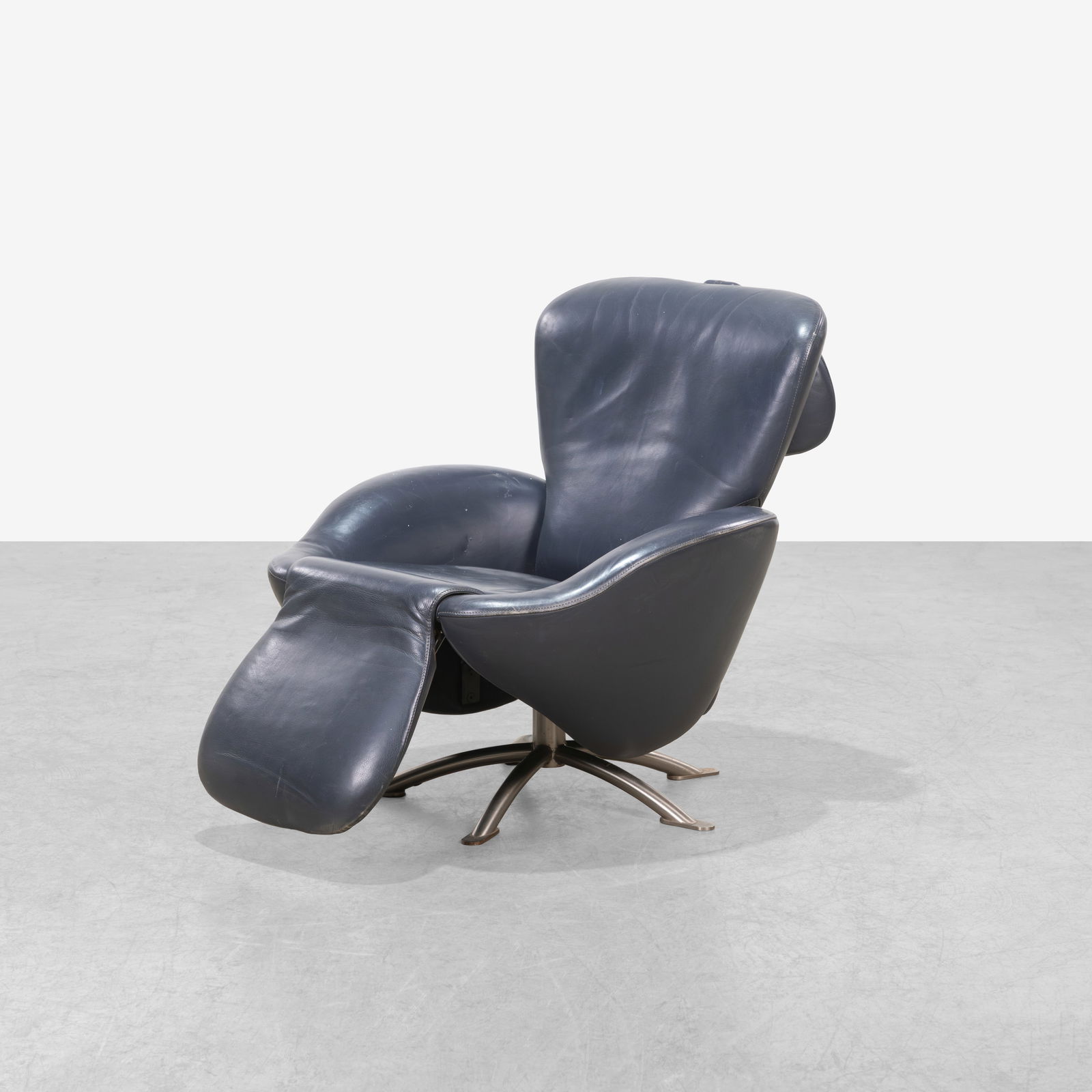 Toshiyuki Kita - Lounge Chair: A leather reclining lounge chair by Toshiyuki Kita for Cassina. Headrest flips up. All measurements are in inches. Height x Width x Depth