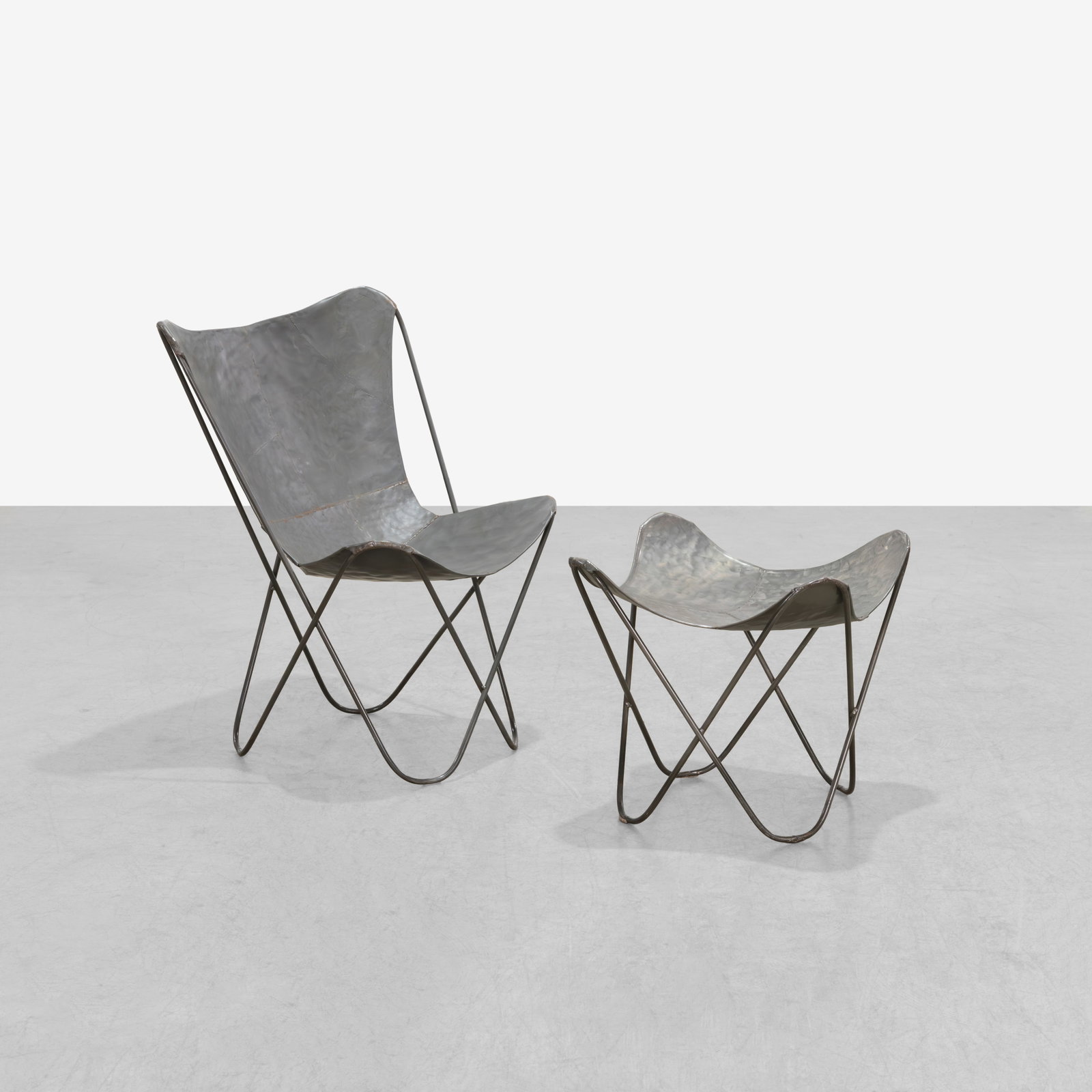 Steel Butterfly Chair & Ottoman: A steel butterfly style chair and ottoman.
