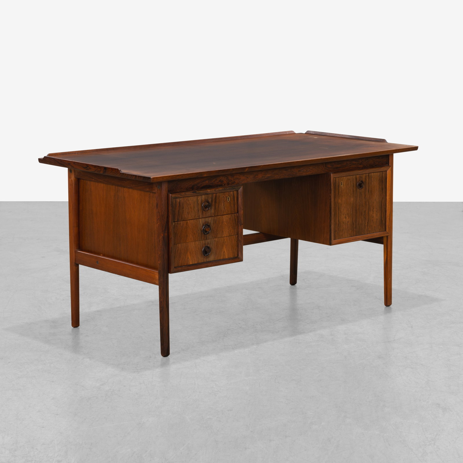 Danish Rosewood Desk: A vintage Danish rosewood desk. All measurements are in inches. Height x Width x Depth