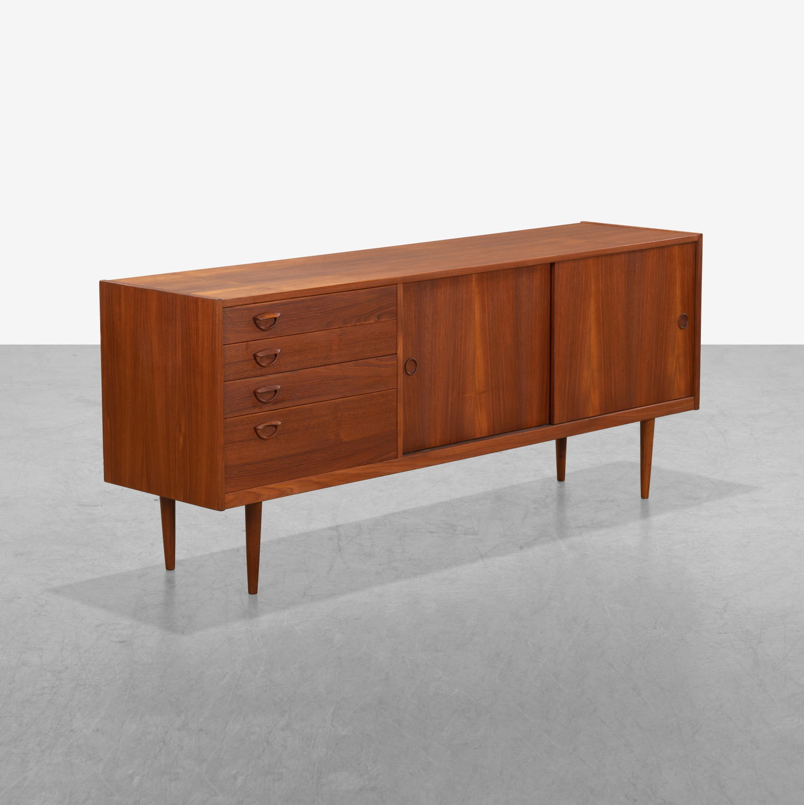 Kai Kristiansen -Teak Credenza: A vintage teak credenza by Kai Kristiansen for All measurements are in inches. Height x Width x Depth