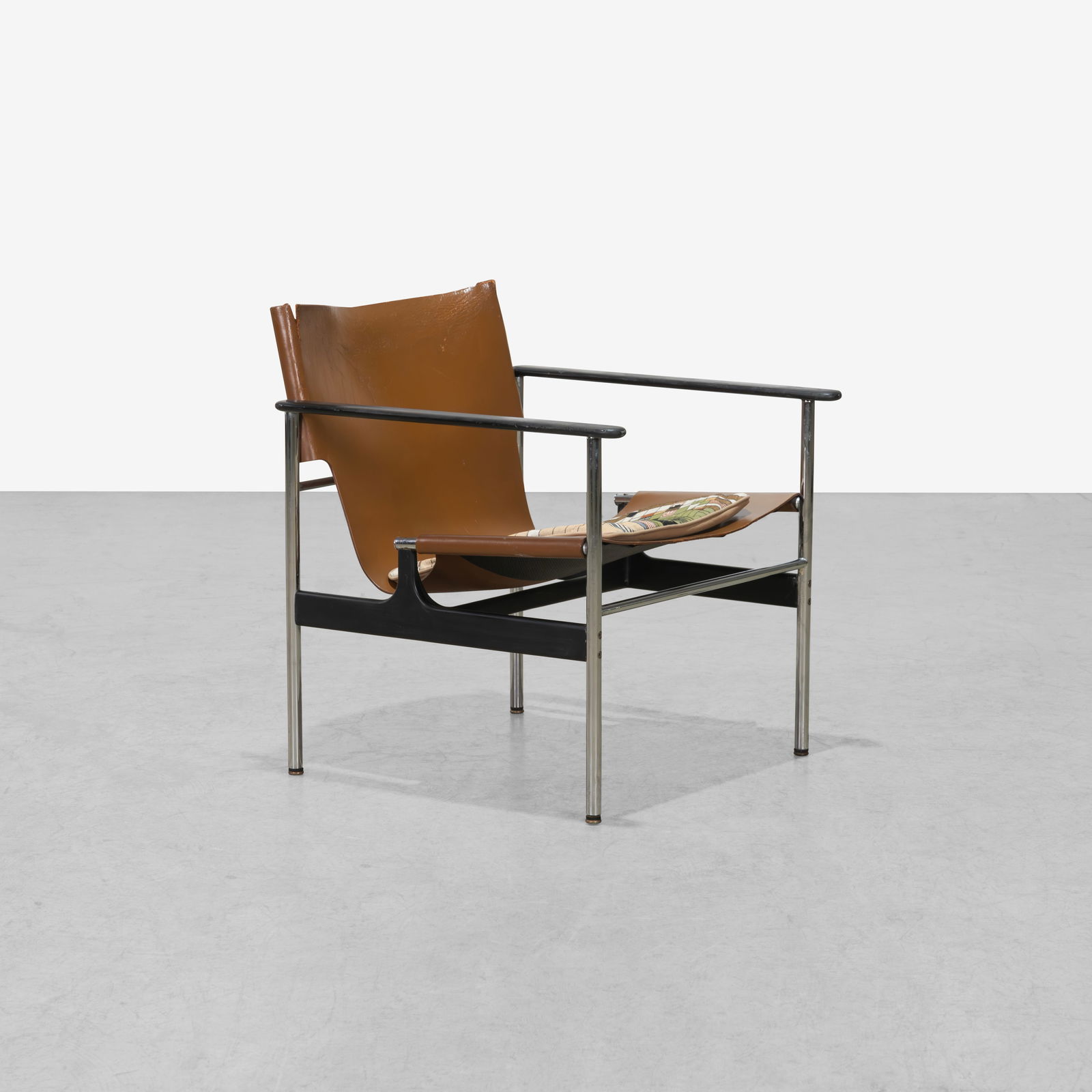 Charles Pollock - Lounge Chair: A vintage leather lounge chair with needlepoint seat cushion by Charles Pollock for Knoll International. All measurements are in inches. Height x Width x Depth