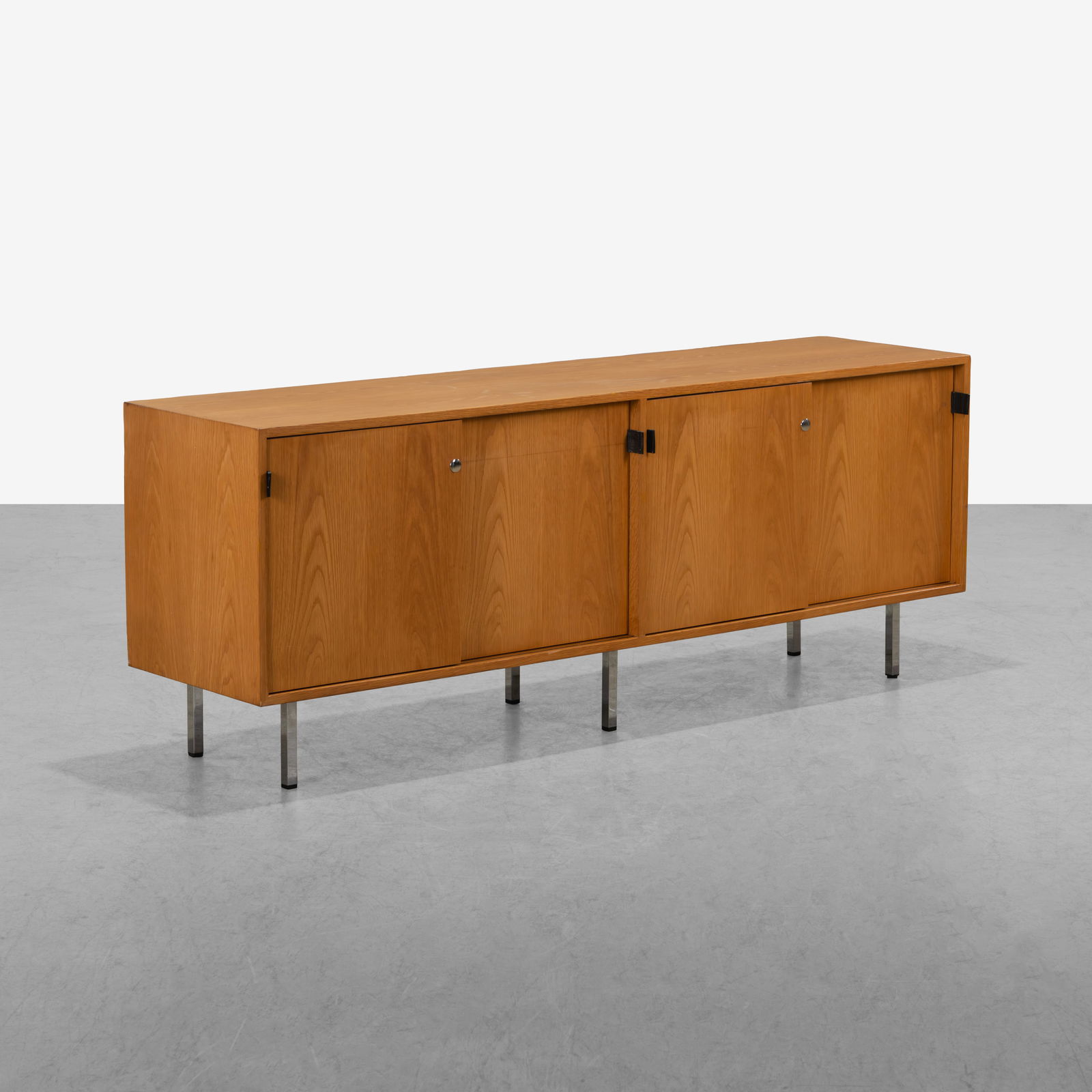 Florence Knoll - Credenza: A vintage oak credenza by Florence Knoll. All measurements are in inches. Height x Width x Depth