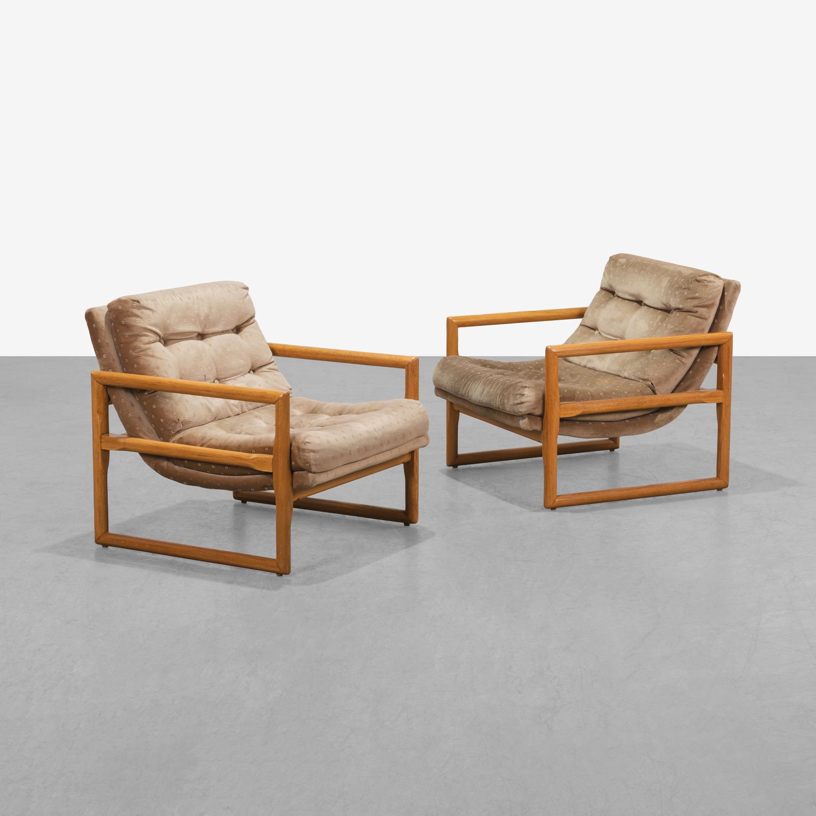 Milo Baughman - Club Chairs: A pair of scoop style club chairs with oak frames by Milo Baughman. All measurements are in inches. Height x Width x Depth