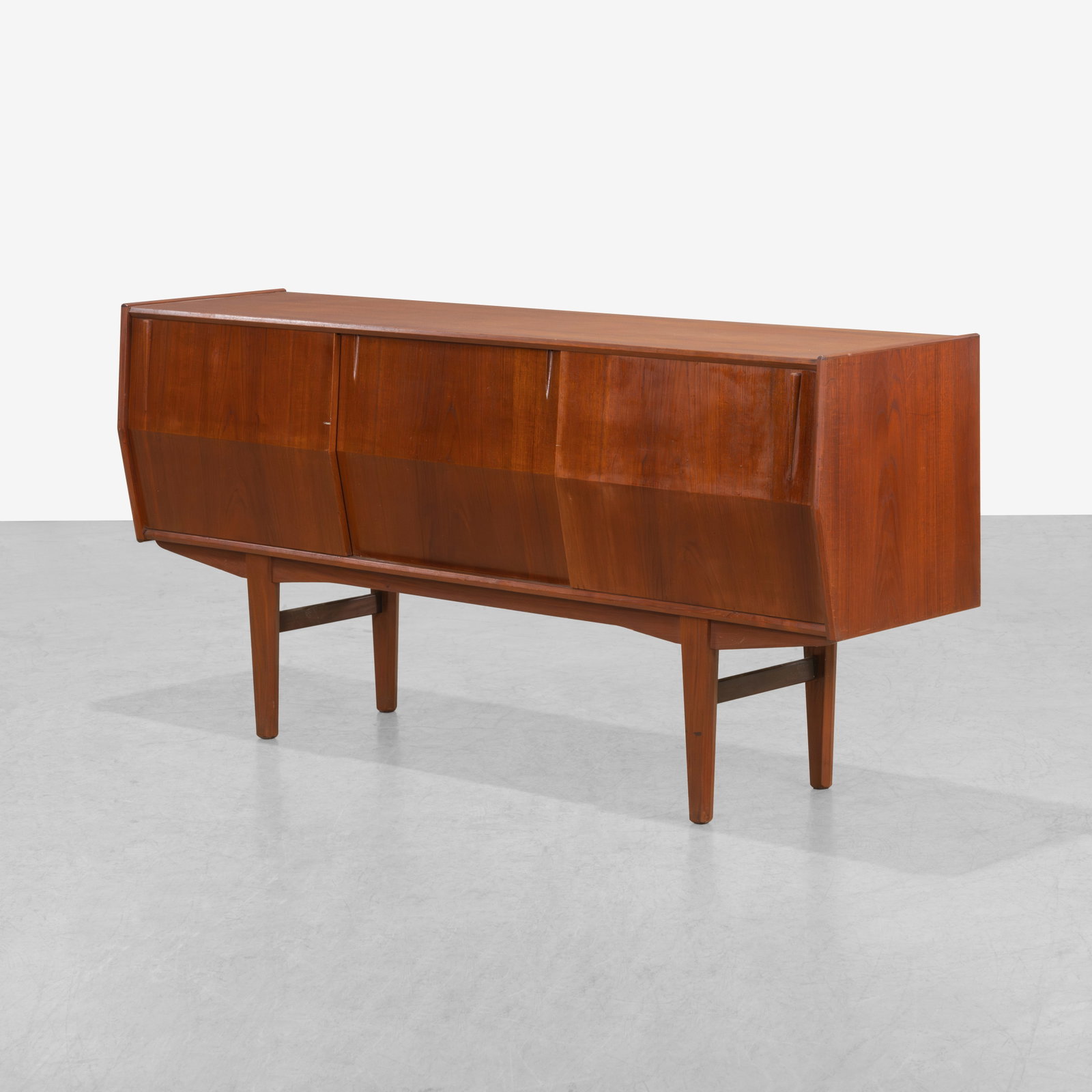 Danish Teak Credenza: A vintage Danish teak credenza with angled doors. All measurements are in inches. Height x Width x Depth
