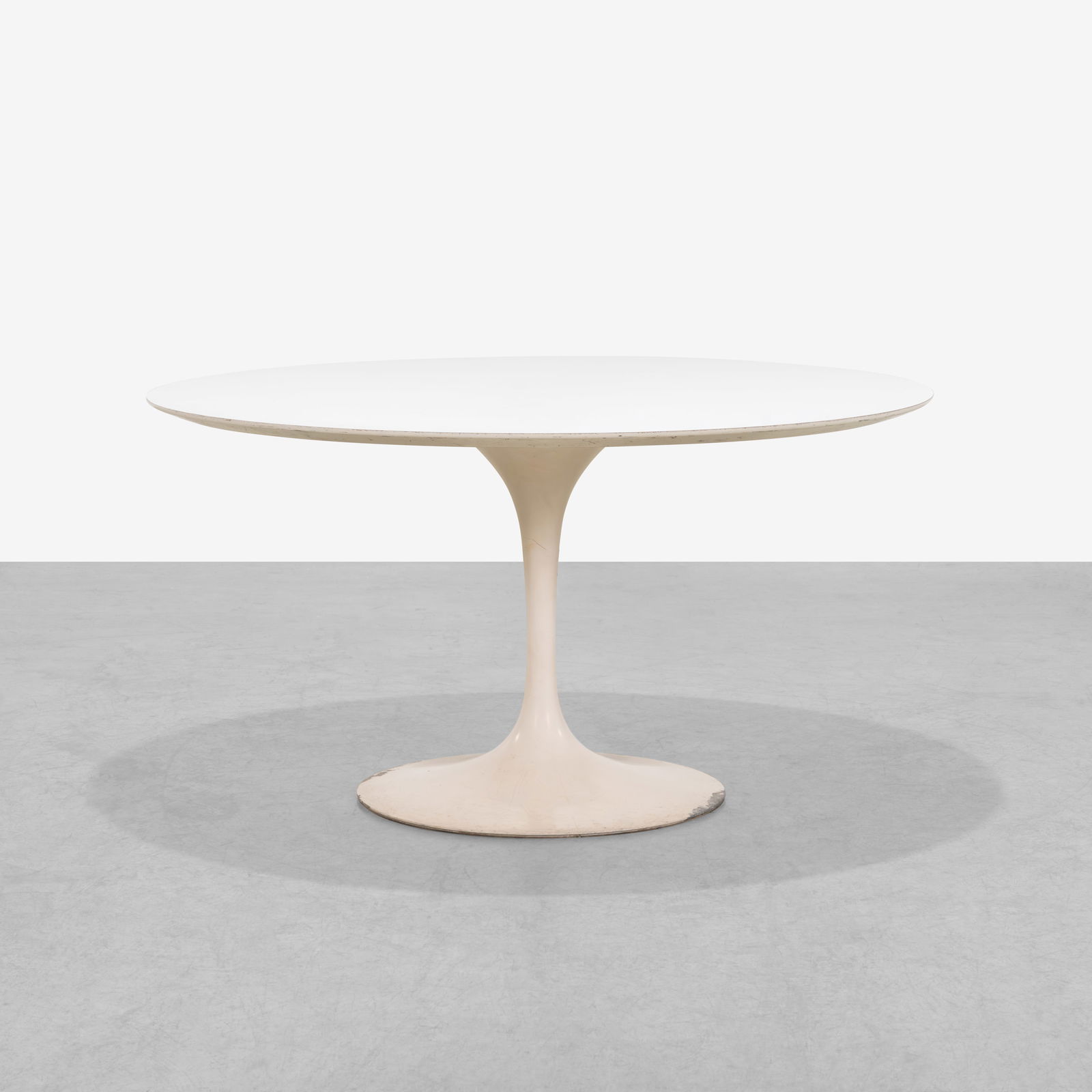 Eero Saarinen - Tulip Table: A tulip base dining table by Eero Saarinen for Knoll. Lacking original labels. All measurements are in inches. Height x Width x Depth