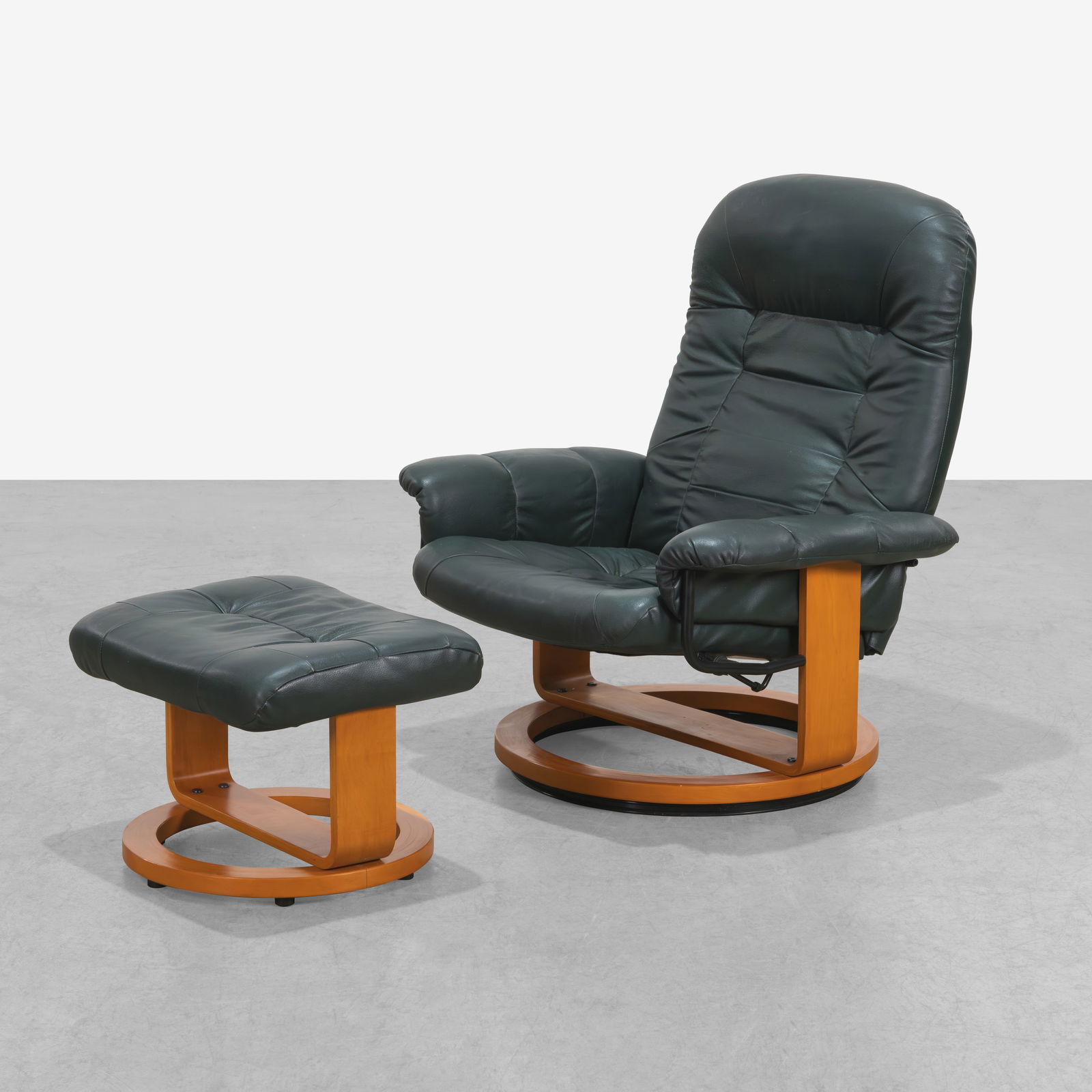 Lounge Chair & Ottoman: A vintage reclining lounge chair and ottoman. Ottoman - 14.5" x 22.5" x 18". All measurements are in inches. Height x Width x Depth