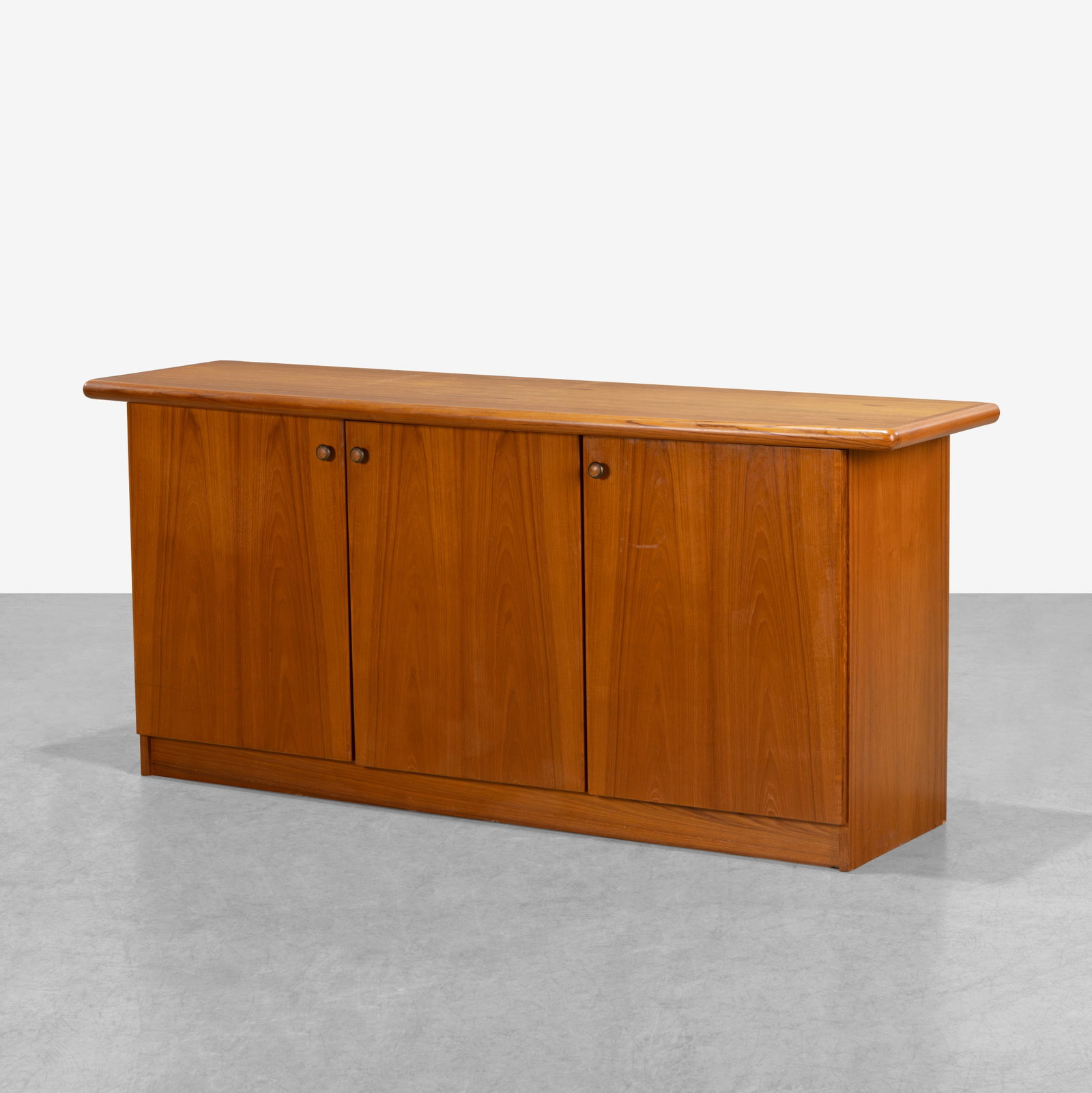 Danish Teak Sideboard: A Danish teak sideboard with paneled back. Interior contains adjustable shelves. All measurements are in inches. Height x Width x Depth