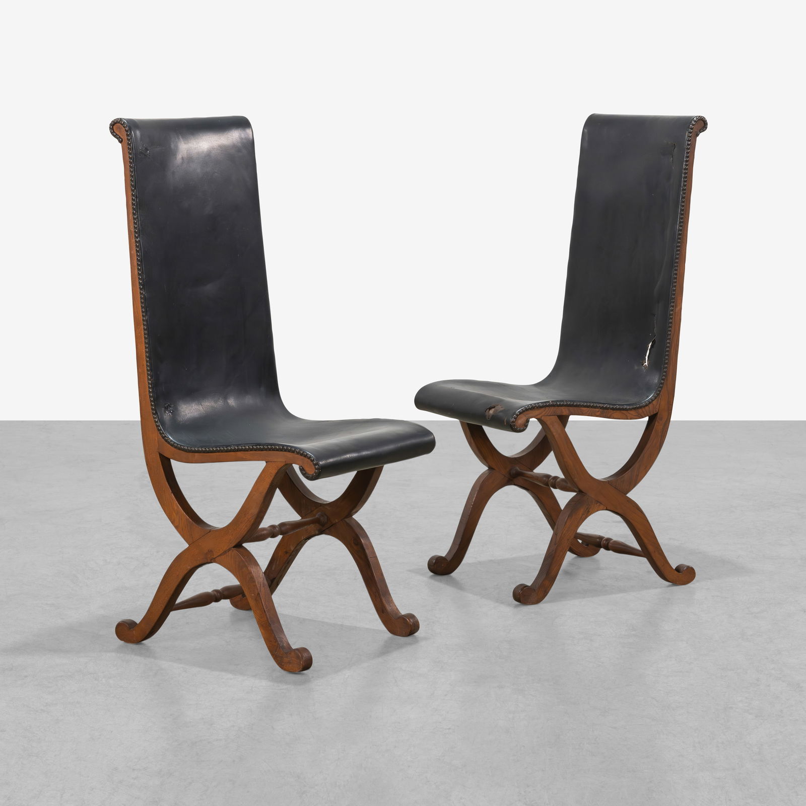 Pierre Lottier (After) - Slipper Chairs: A pair of leather slipper chairs in the manner of Pierre Lottier. All measurements are in inches. Height x Width x Depth