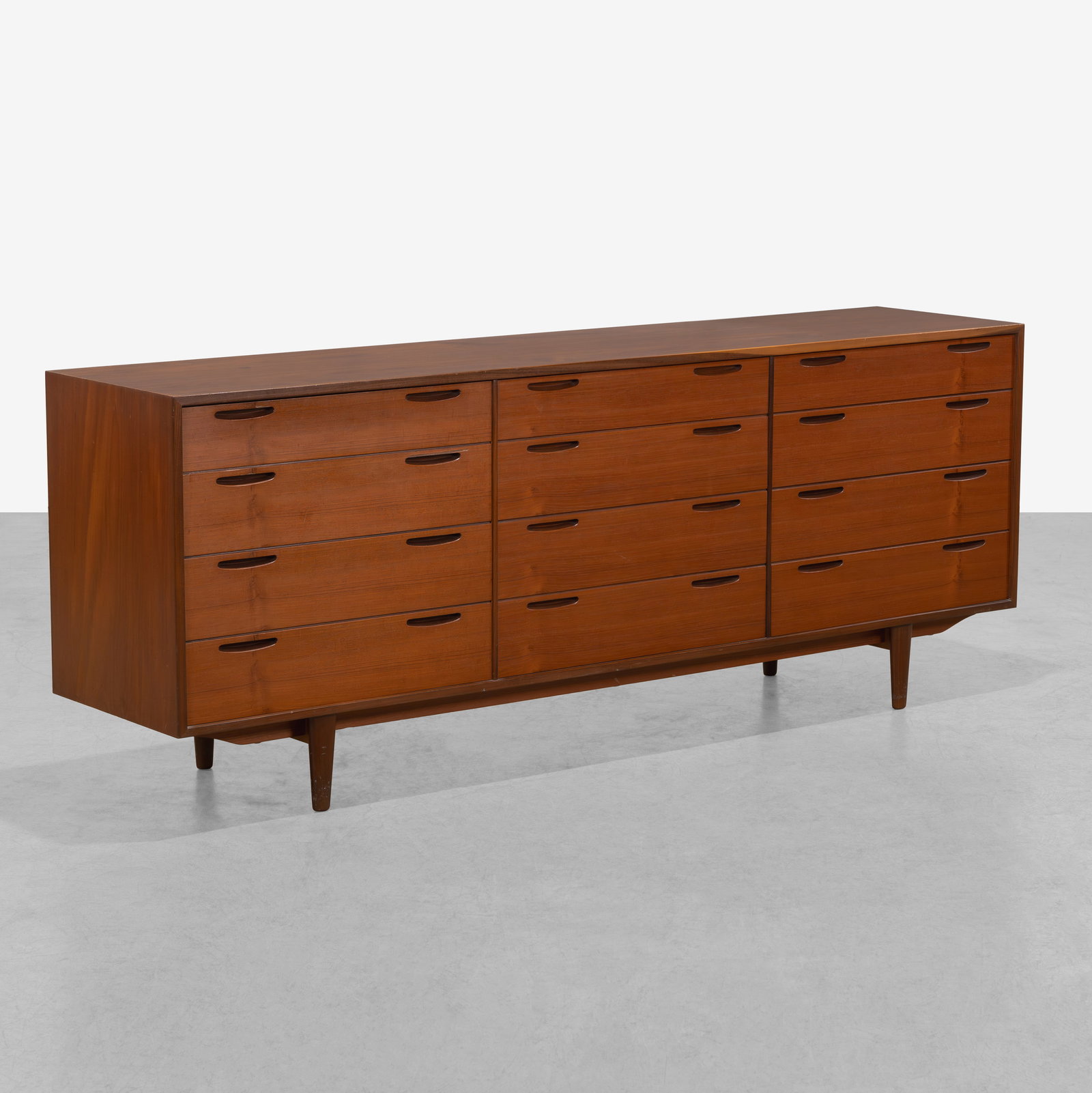 Ib Kofod-Larsen - Dresser: A teak double dresser by Ib Kofod-Larsen. All measurements are in inches. Height x Width x Depth