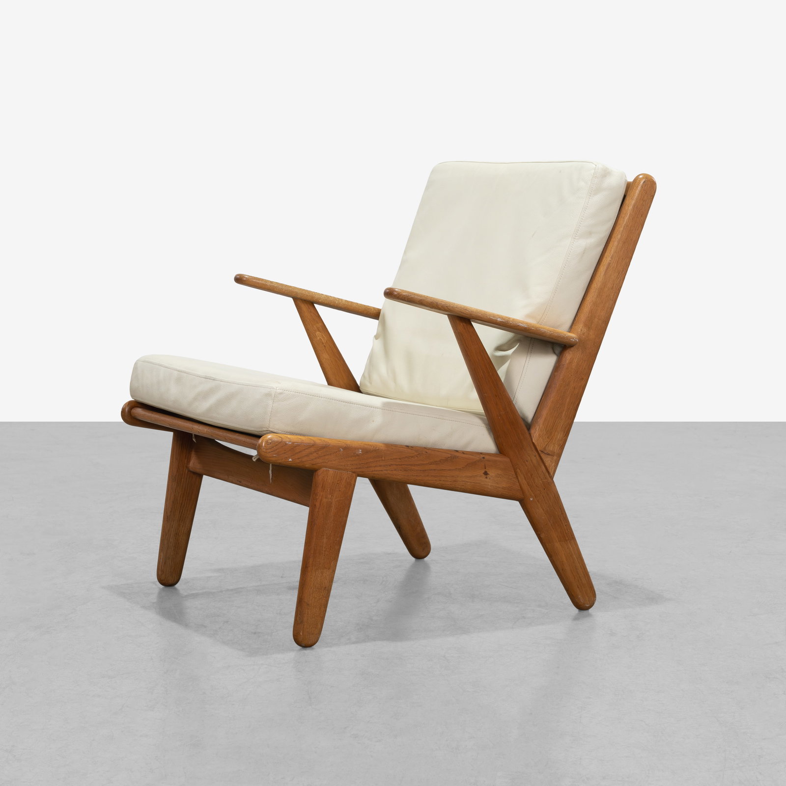 Poul Volther - Lounge Chair: A oak and leather J53 lounge chair by Poul Volther for FDB Mobler, Denmark. All measurements are in inches. Height x Width x Depth