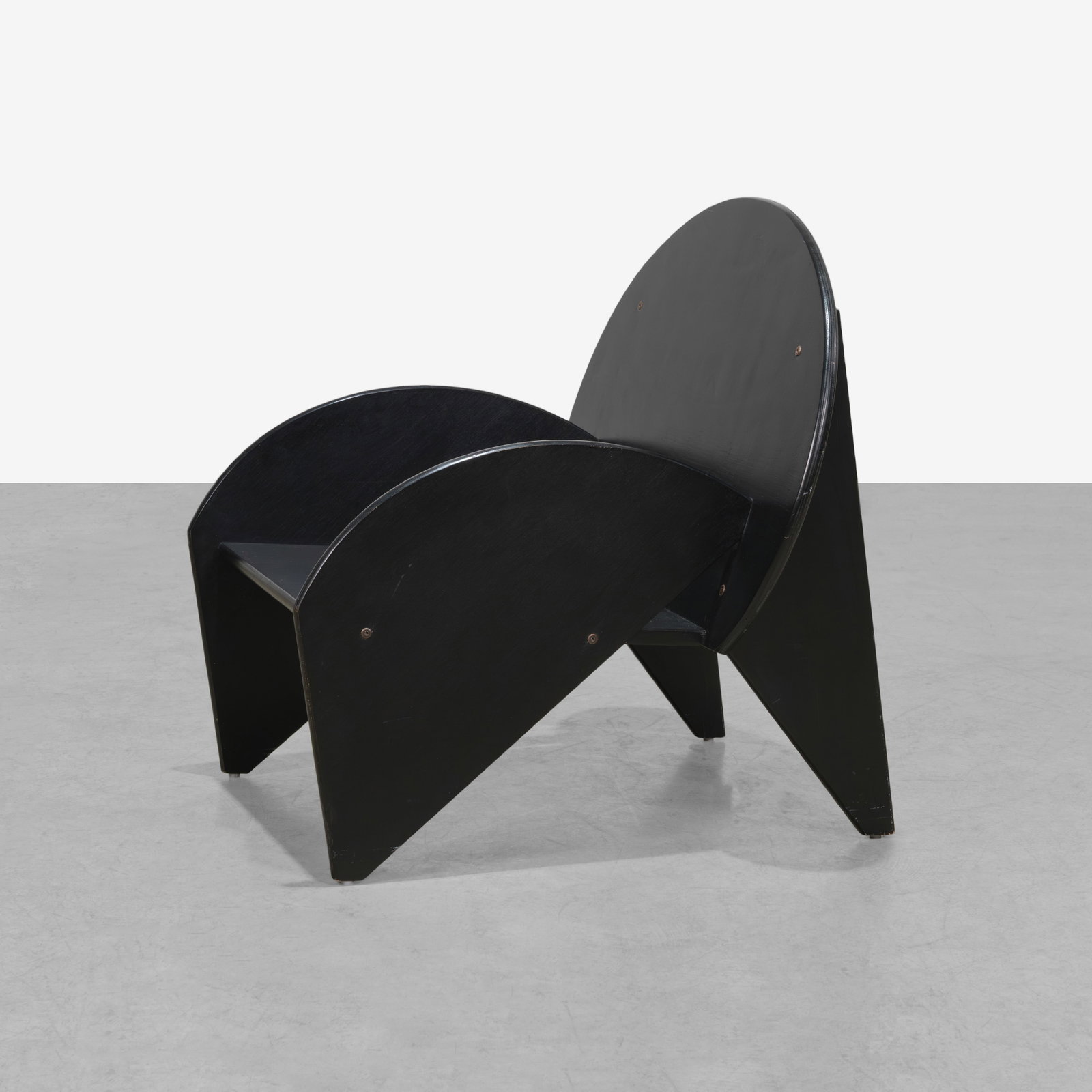 Black Plywood Chair: A vintage ebonized plywood lounge chair. All measurements are in inches. Height x Width x Depth