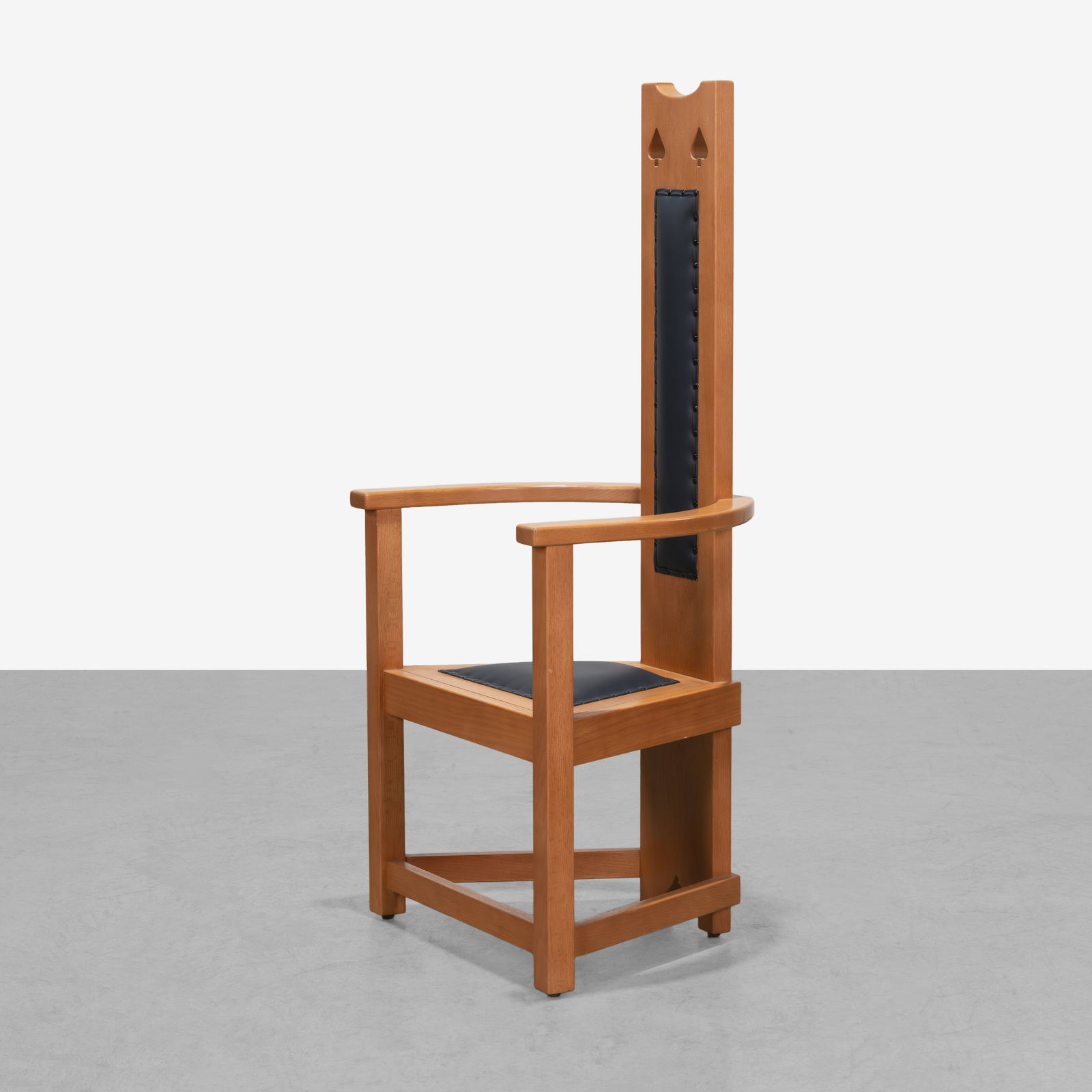 M. H. Baillie-Scott (After) - Armchair: A reproduction of a high back chair by Mackay-Hugh Baillie-Scott in oak. Stamped on the underside of the seat 'Union Made Quality.' All measurements are in inches. Height x Width x Depth