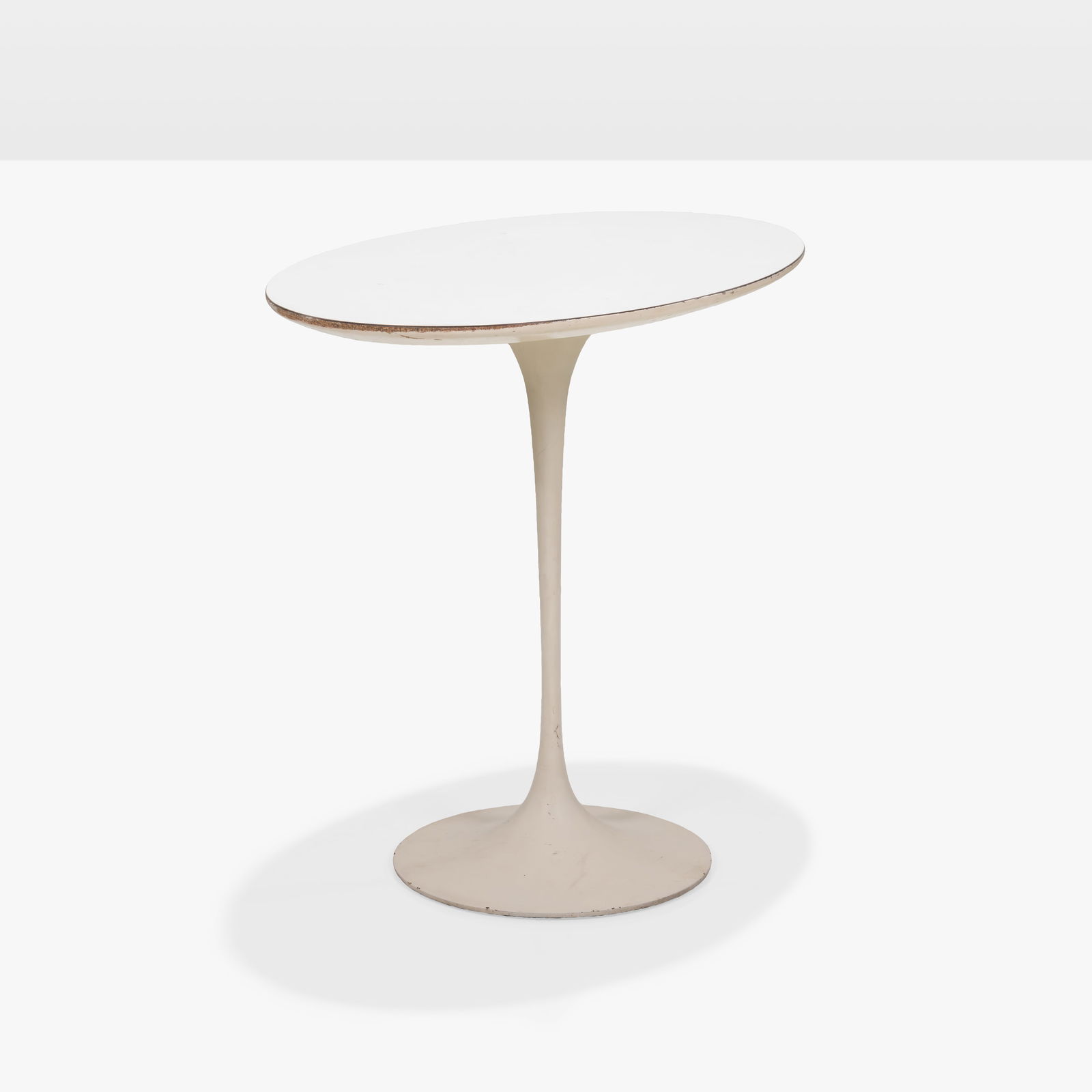 Eero Saarinen - Tulip Table: A tulip table by Eero Saarinen for Knoll. Label on underside. All measurements are in inches. Height x Width x Depth