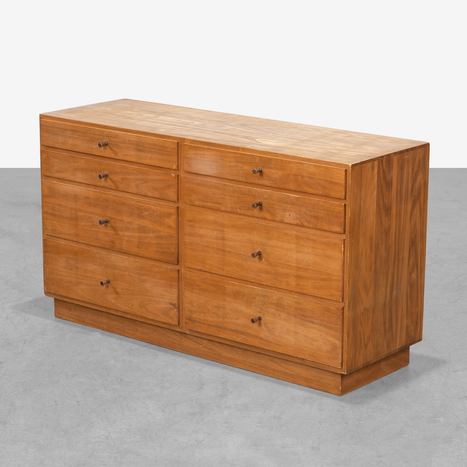 Paul McCobb (After) - Low Dresser: A vintage low dresser with 'bullet' pulls in the manner of Paul McCobb. All measurements are in inches. Height x Width x Depth