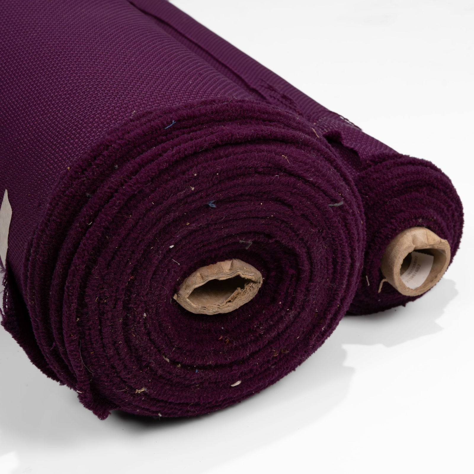 Knoll - Purple - Upholstery Fabric: A partial roll of unknown model 'Purple' upholstery fabric by Knoll. Approximately 30 yards of fabric. All measurements are in inches. Height x Width x Depth