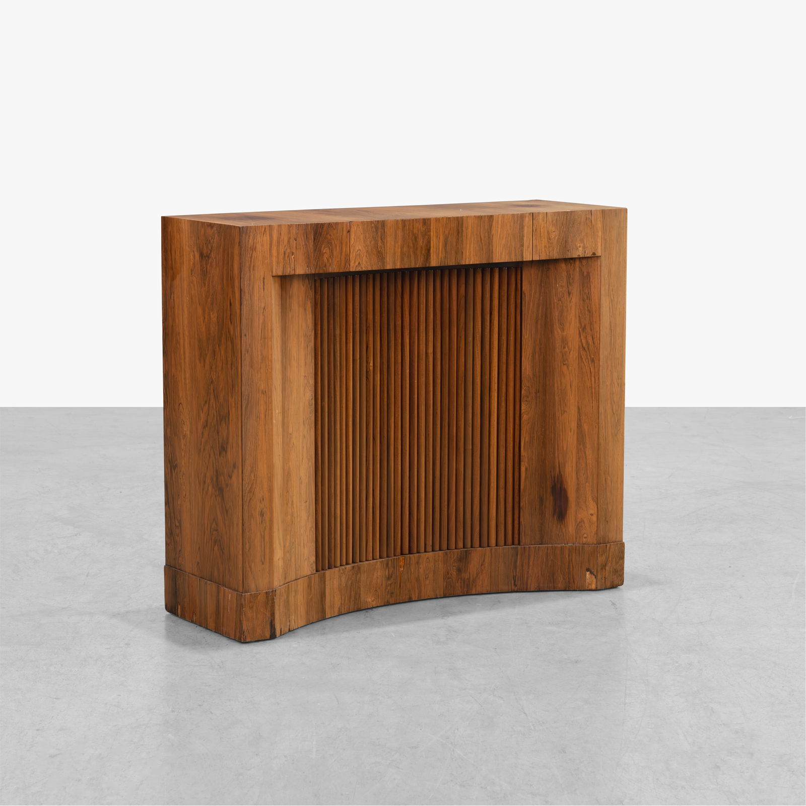 Edward Wormley - Tambour Server: A rare, rosewood console table by Edward Wormley for Dunbar. With center drawer and tambour door that exposes a single shelf. Stamped on back corner.