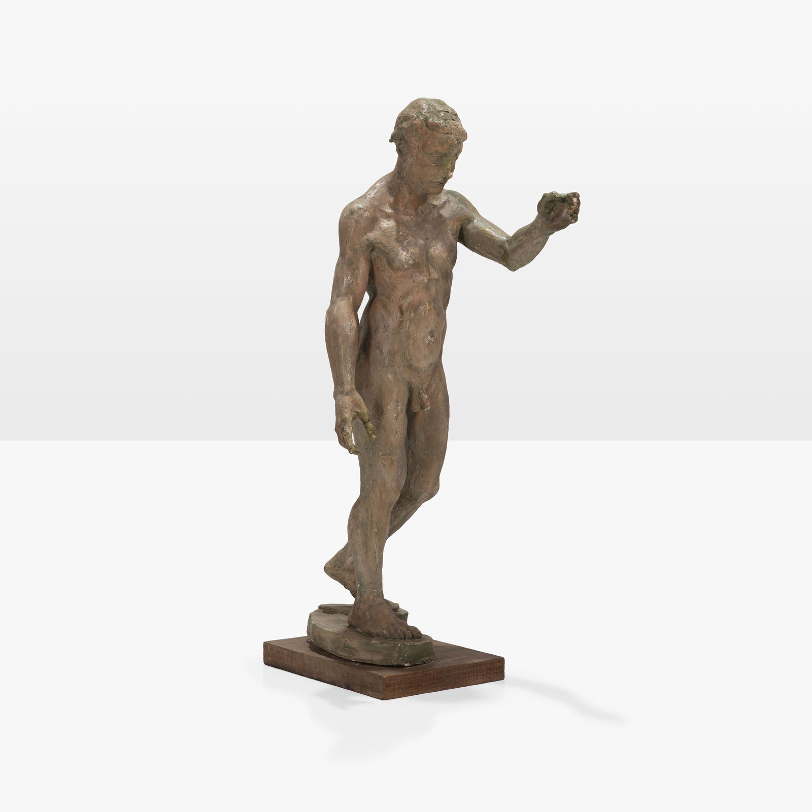 Figural Nude Plaster Sculpture: A vintage plaster sculpture of a nude man.