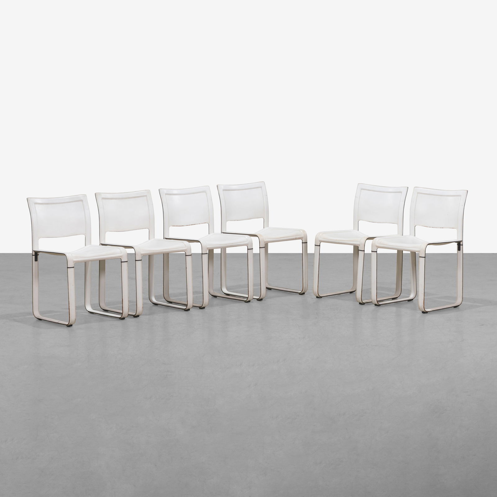 Tito Agnoli - Sistina Chairs: A set of six leather 'Sistina' chairs by Tito Agnoli for Matteo Grassi. All measurements are in inches. Height x Width x Depth