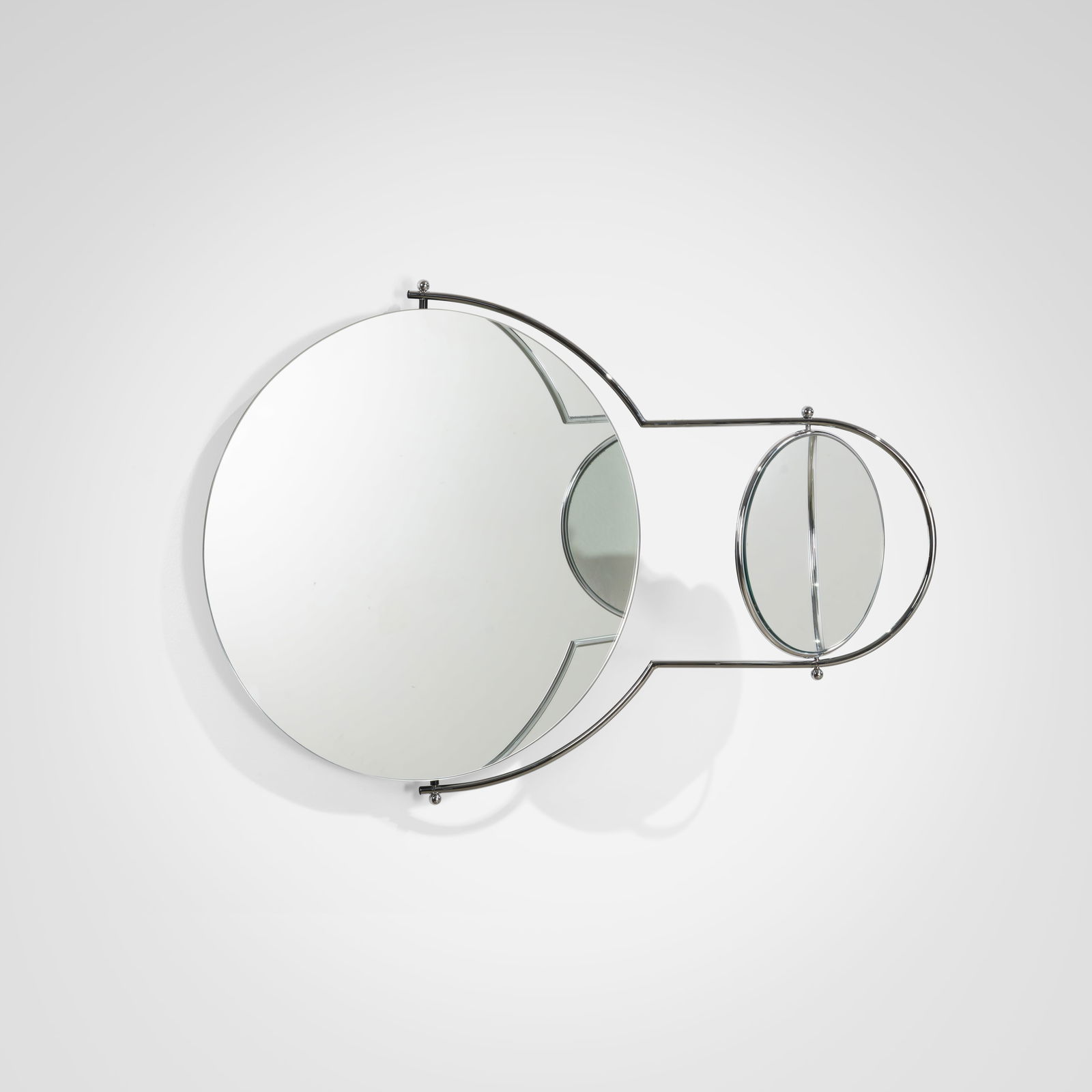 Orbit Mirror: A vintage 'Orbit' mirror by OMK Designs, London. All measurements are in inches. Height x Width x Depth