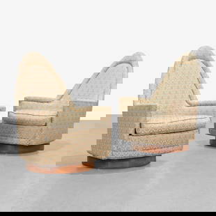 Swiveling Lounge Chairs: A pair of vintage swiveling lounge chairs with tall backs and wood pedestal bases by Selig. Lacking original labels. Swiveling bases return to original position. All measurements are in inches. Height