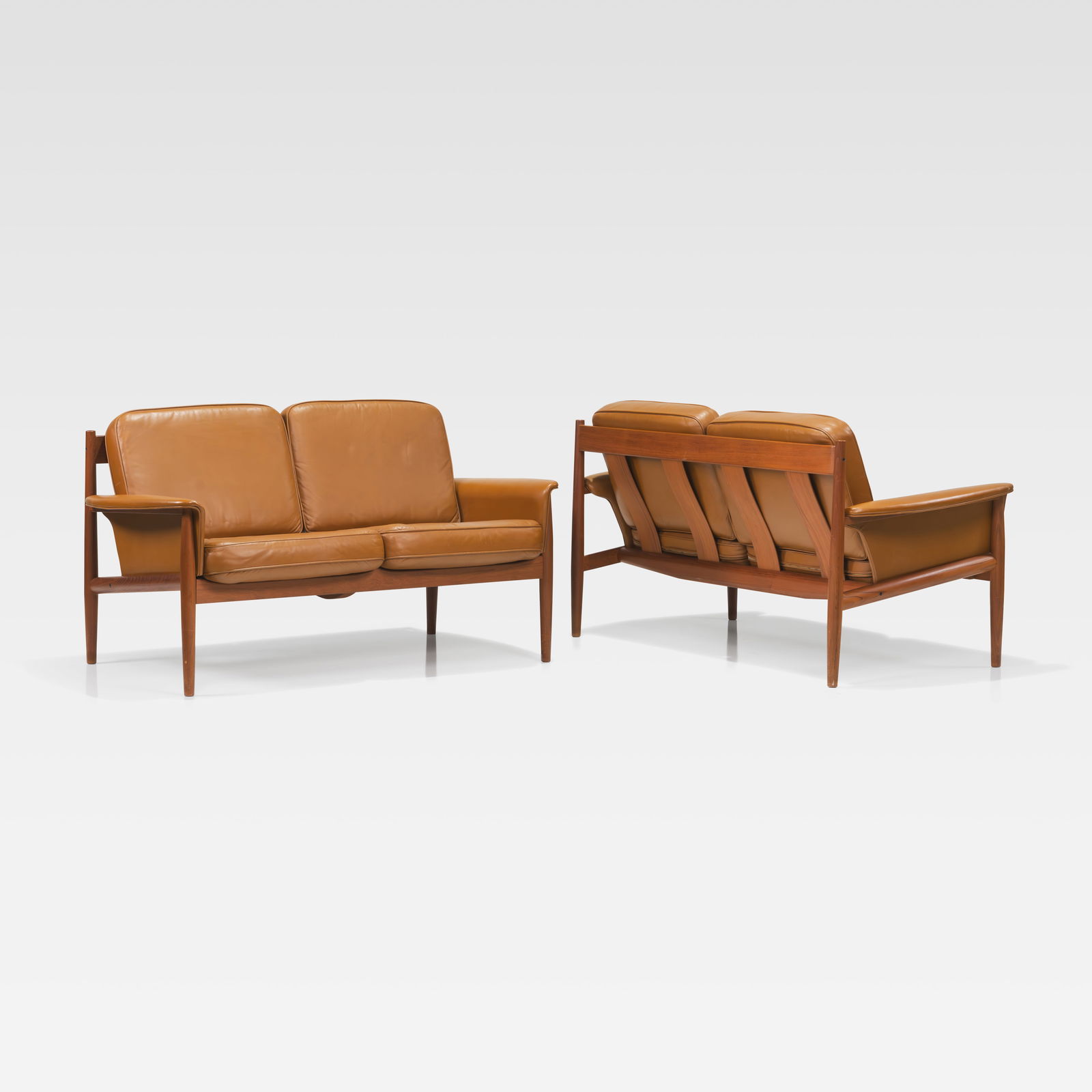 Greta Jalk - Loveseats: A pair of teak and leather loveseats by Greta Jalk for France & Son, Denmark. All measurements are Height x Width x Depth. September 26th Fire On September 26, a minor printer-related fire occurred in
