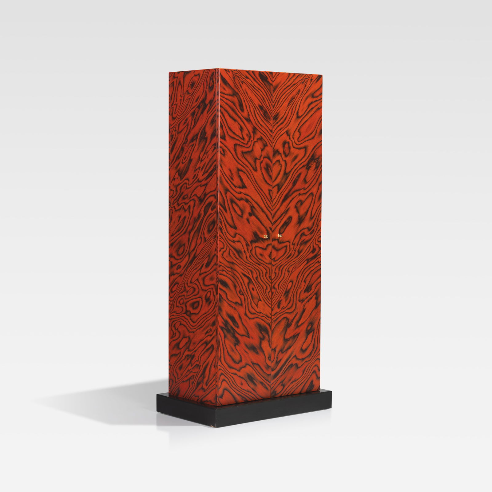 Ettore Sottsass - Nairobi Bar Cabinet: A tall 'Nairobi' bar cabinet in aniline-dyed wood on a pedestal base by Ettore Sottsass for Zanotta, Italy. Signed on top of the side. Fully finished back and top. PLEASE NOTE THE DAMAGE TO THE BASE.