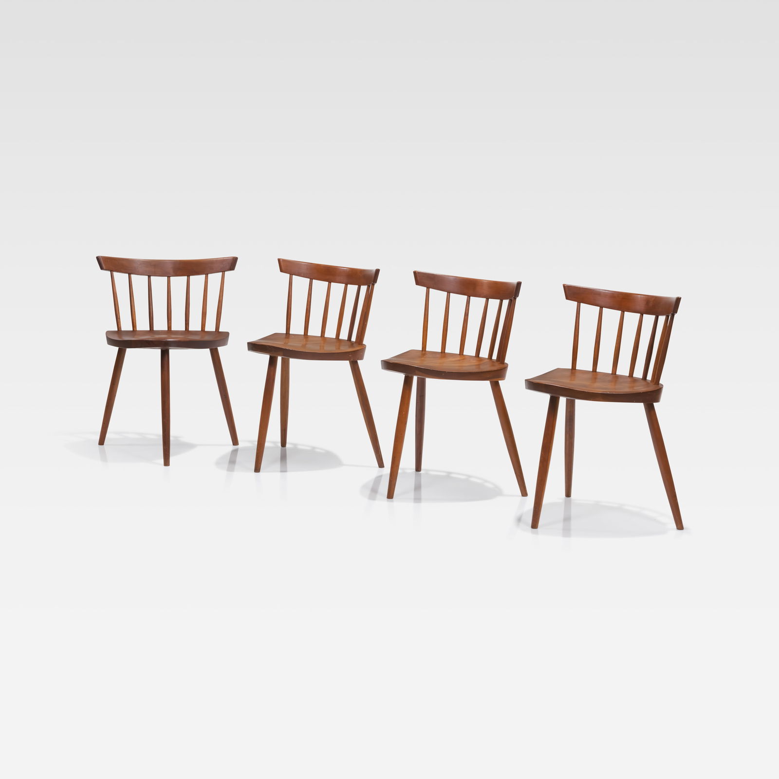 George Nakashima - Mira Chairs: A set of four 'Mira' chairs in cherry wood by George Nakashima. Inscribed on bottom of seat with customer name. All measurements are Height x Width x Depth. September 26th Fire On September 26, a mino